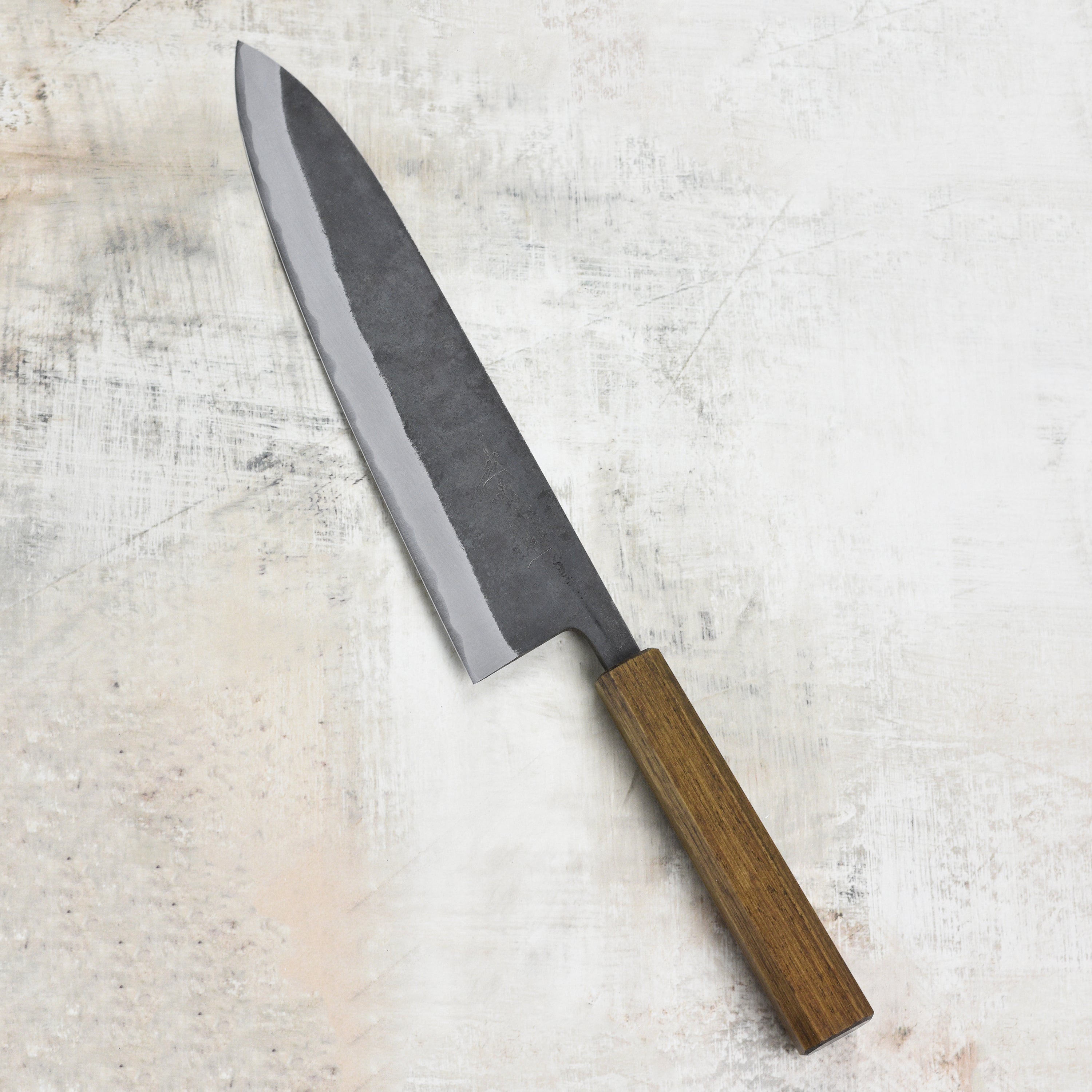 Close-up of the Shiro Kamo Aogami Gyutos handle and blade, highlighting the craftsmanship.