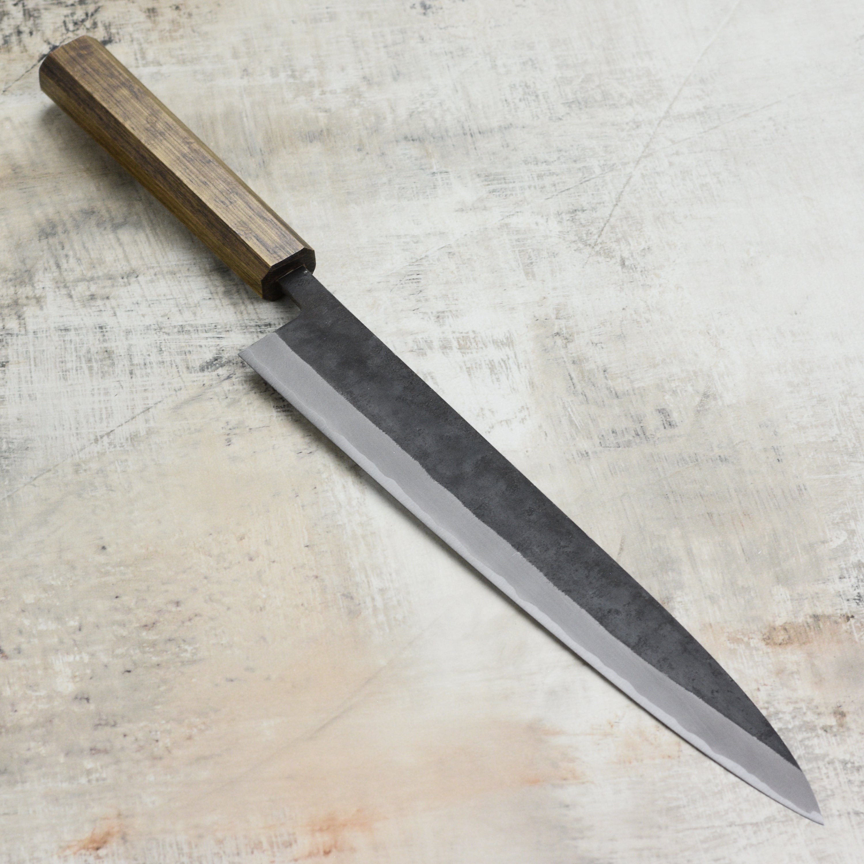 Chef using the Shiro Kamo Aogami Sujihiki Knife for slicing sashimi.