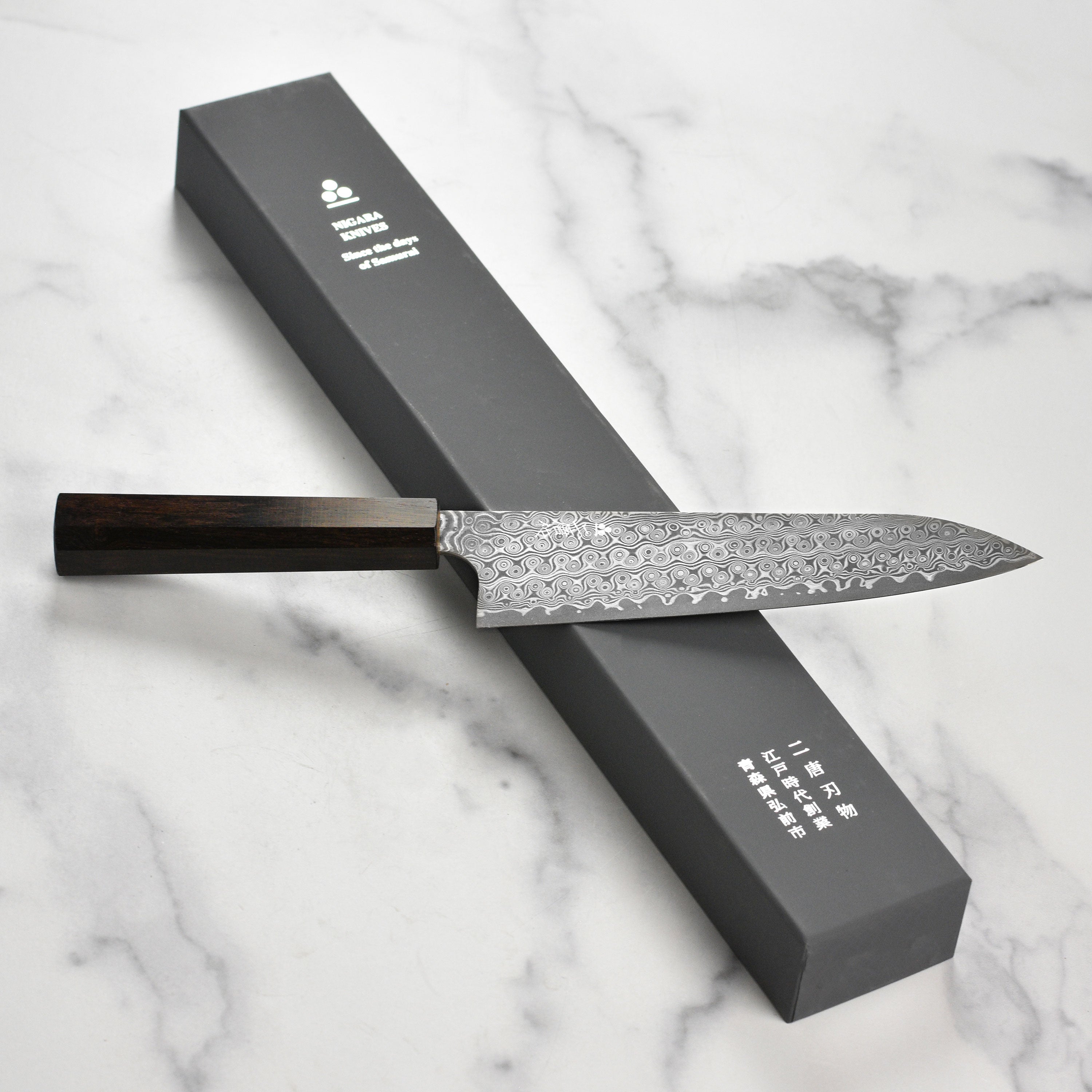 Close-up of the handle and blade of the Japanese chef knife for precision cutting