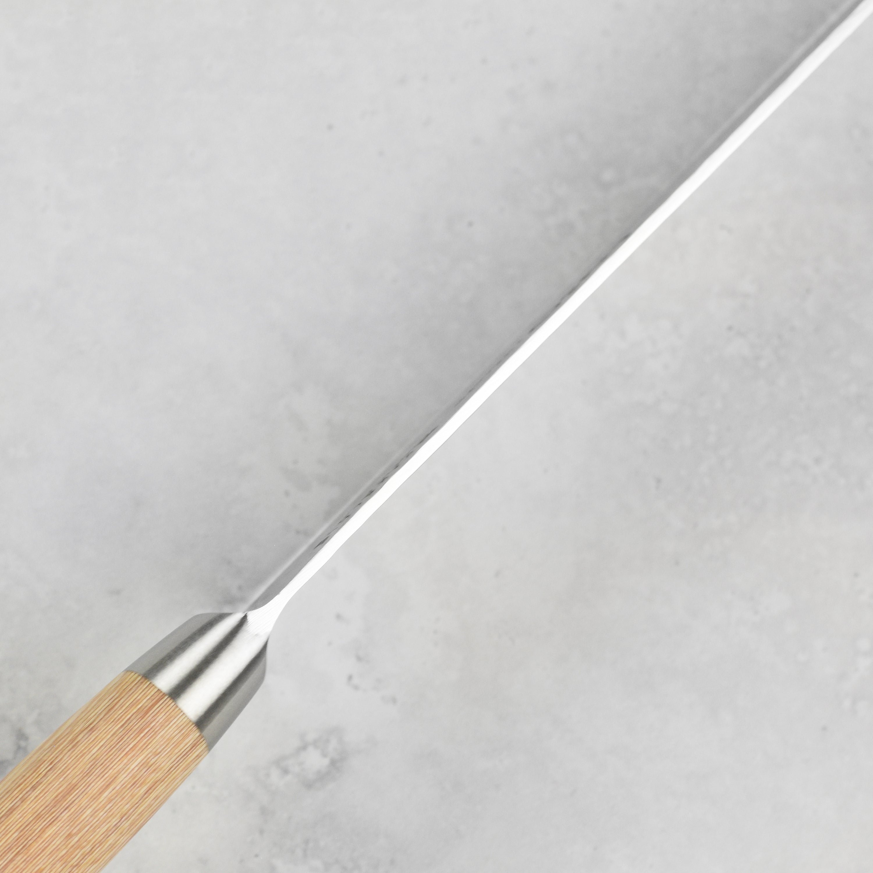 Profile view of the Enso Hizashi Paring knife with pakkawood handle, showcasing its elegant design and craftsmanship.