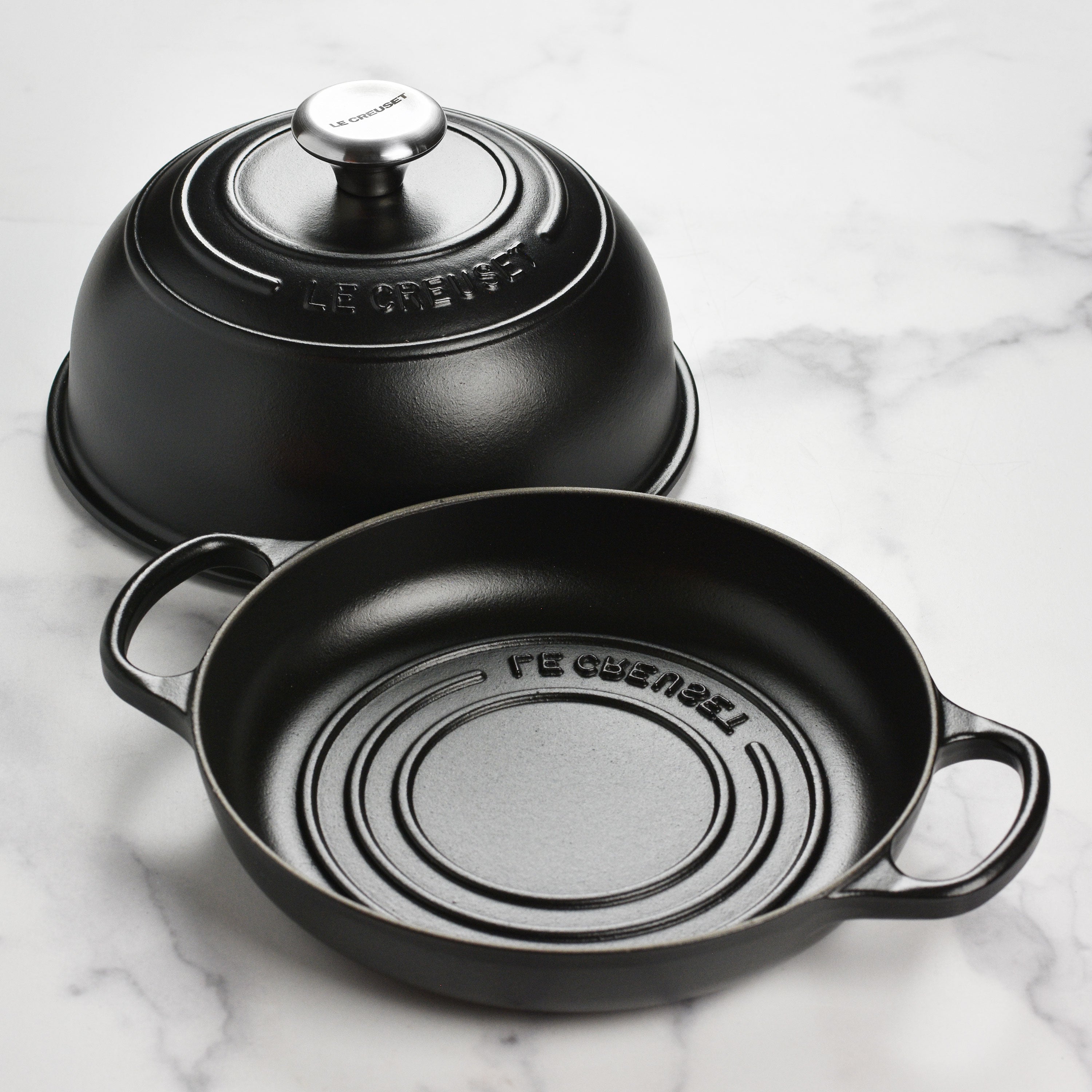 Le Creuset cast iron oven with lid off, showing the interior for baking bread and other baked goods