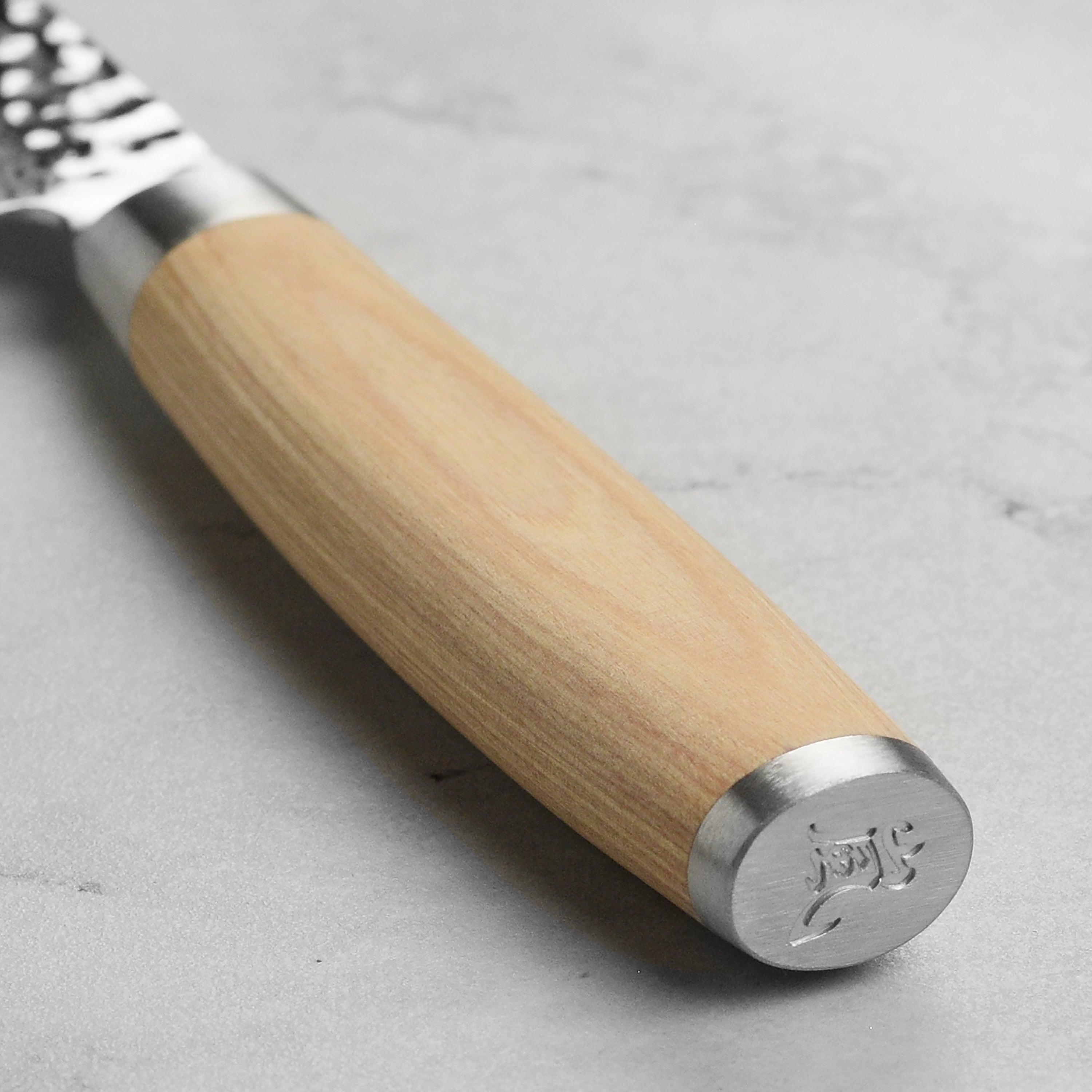 Close-up of the hammered finish on the Enso Damascus paring knife, highlighting its craftsmanship.