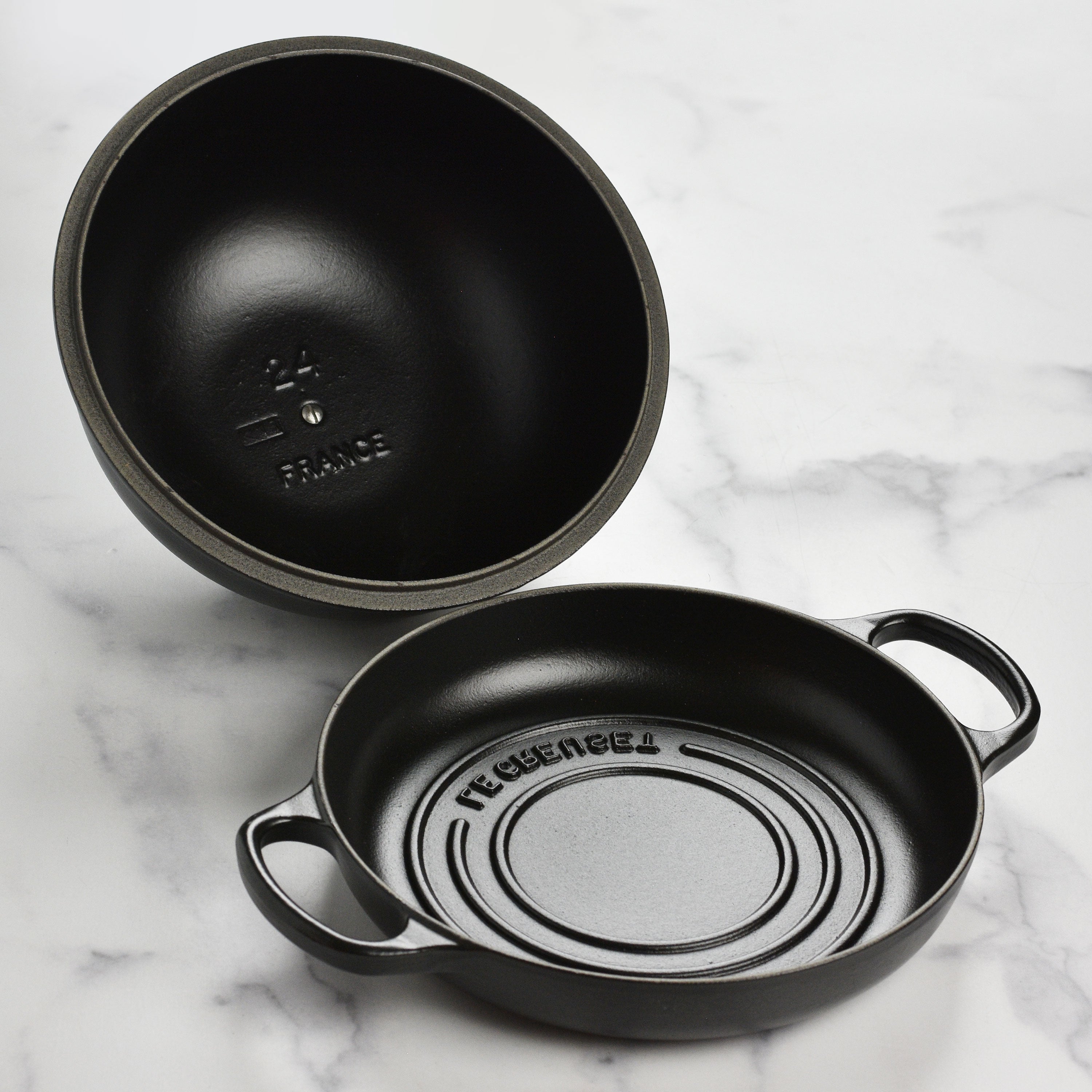 Bread baking inside the Le Creuset cast iron oven, emphasizing even heat distribution and crust formation