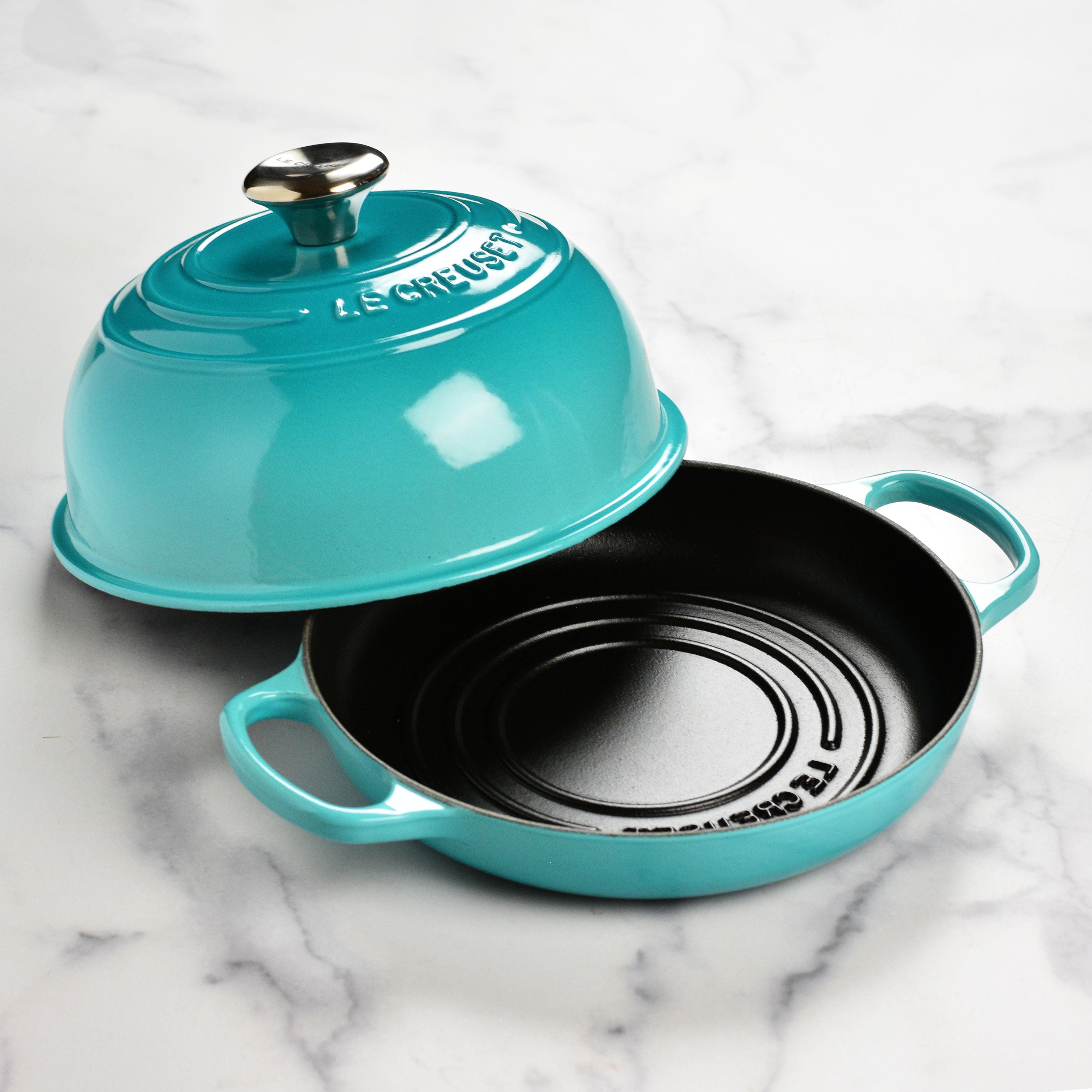 Le Creuset Caribbean bread oven with a domed lid, showcasing even heat distribution
