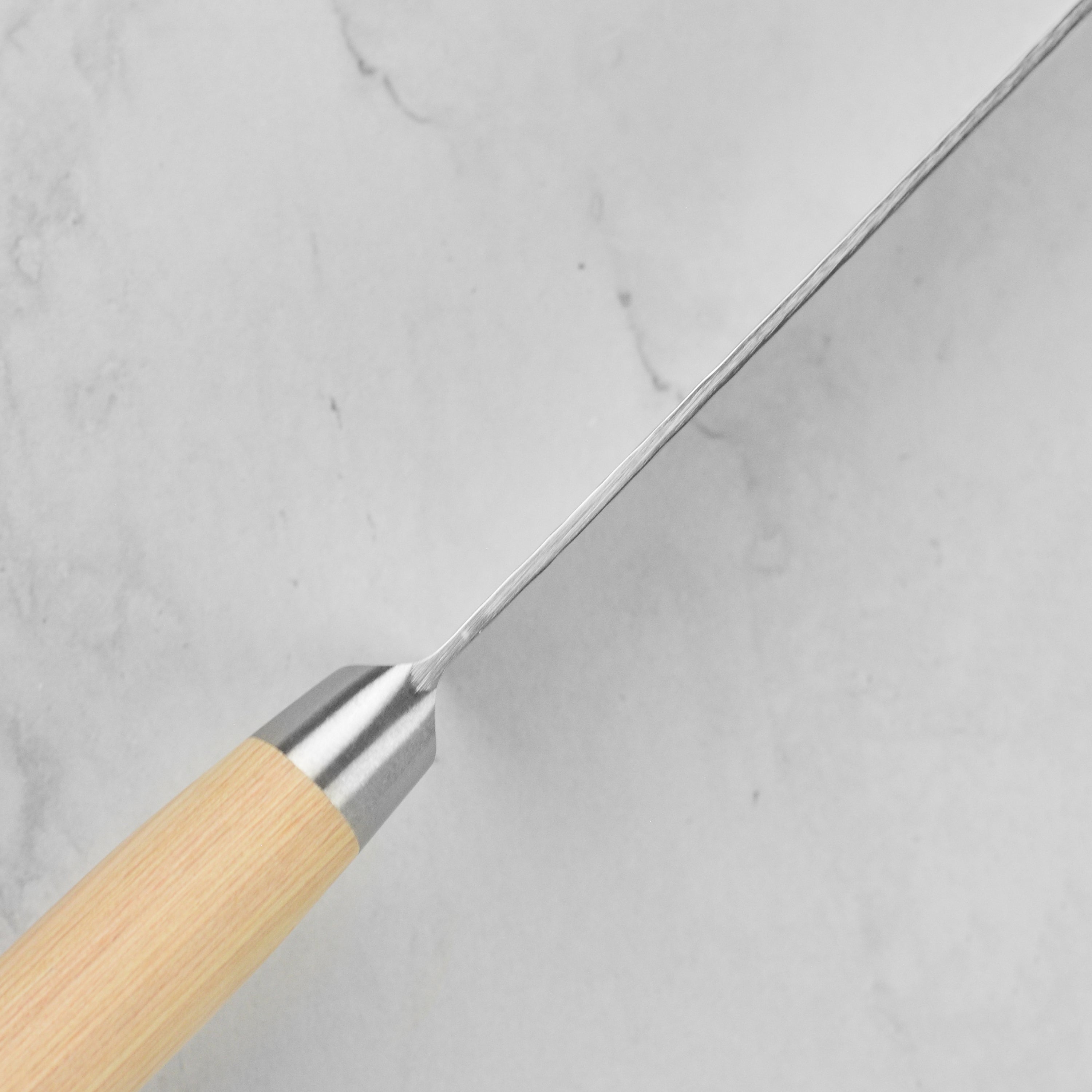 Damascus chefs knife with hammered finish for professional kitchens