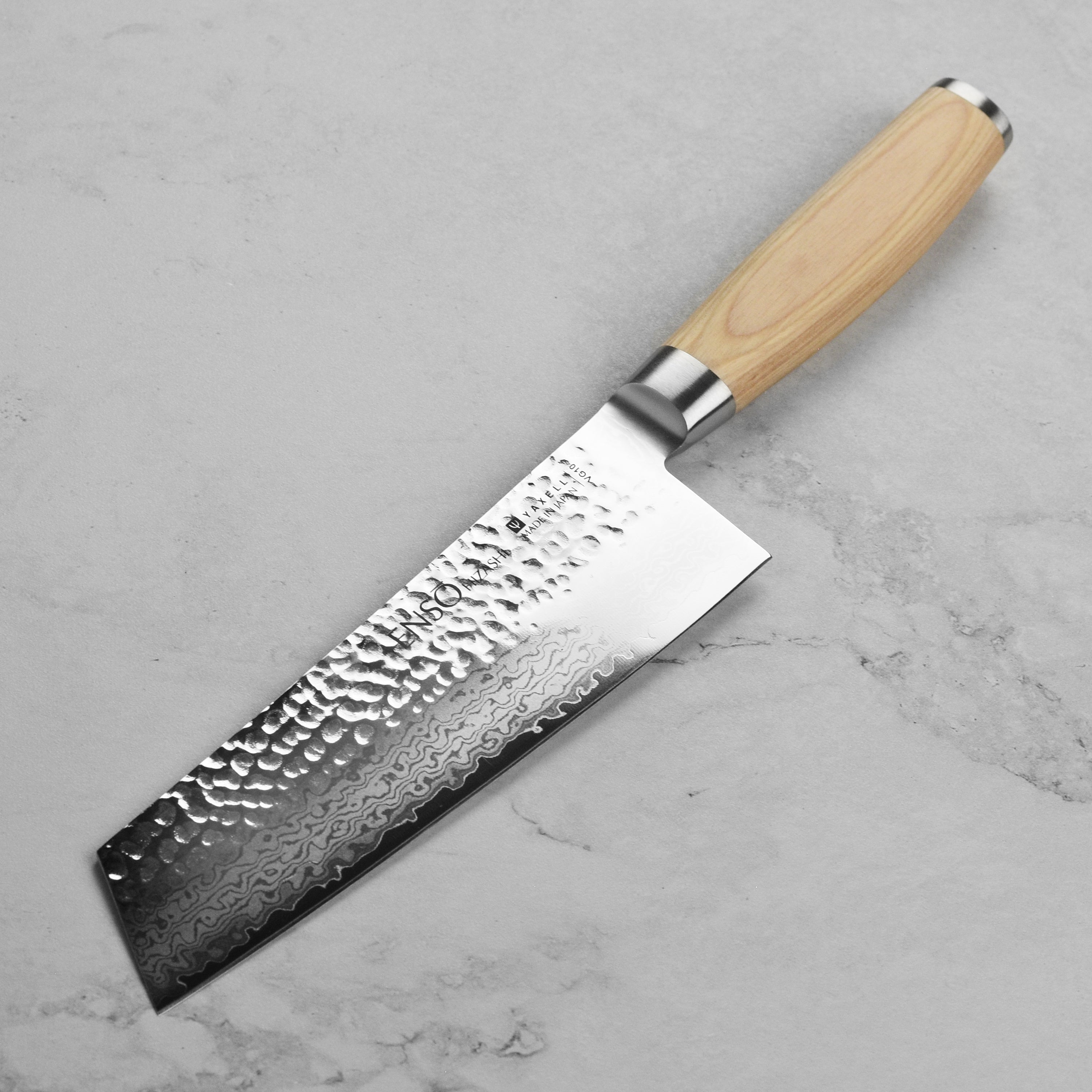 Close-up of the VG-10 steel blade and engraved end cap