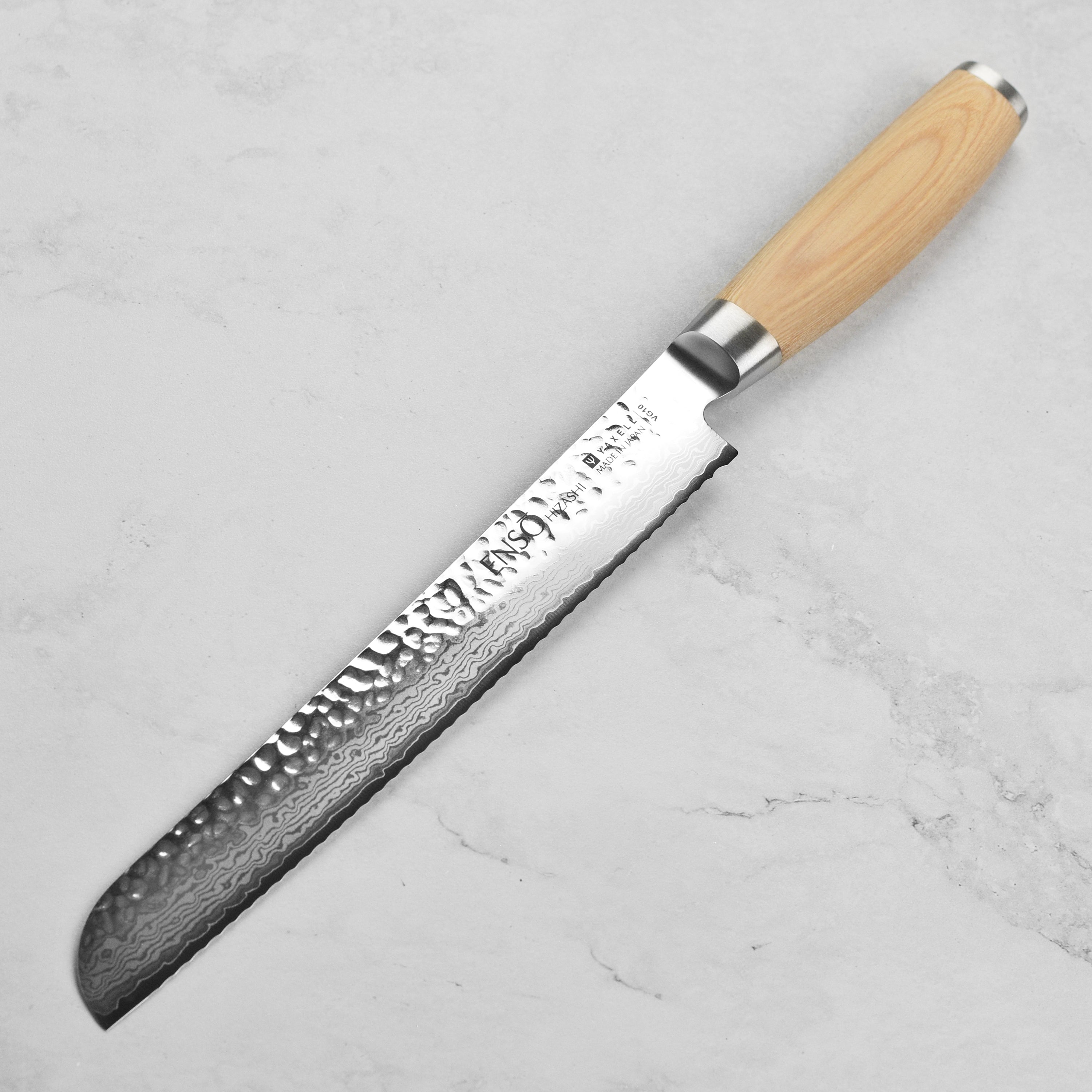 Handcrafted Japanese kitchen knife with pakkawood handle and engraved end cap