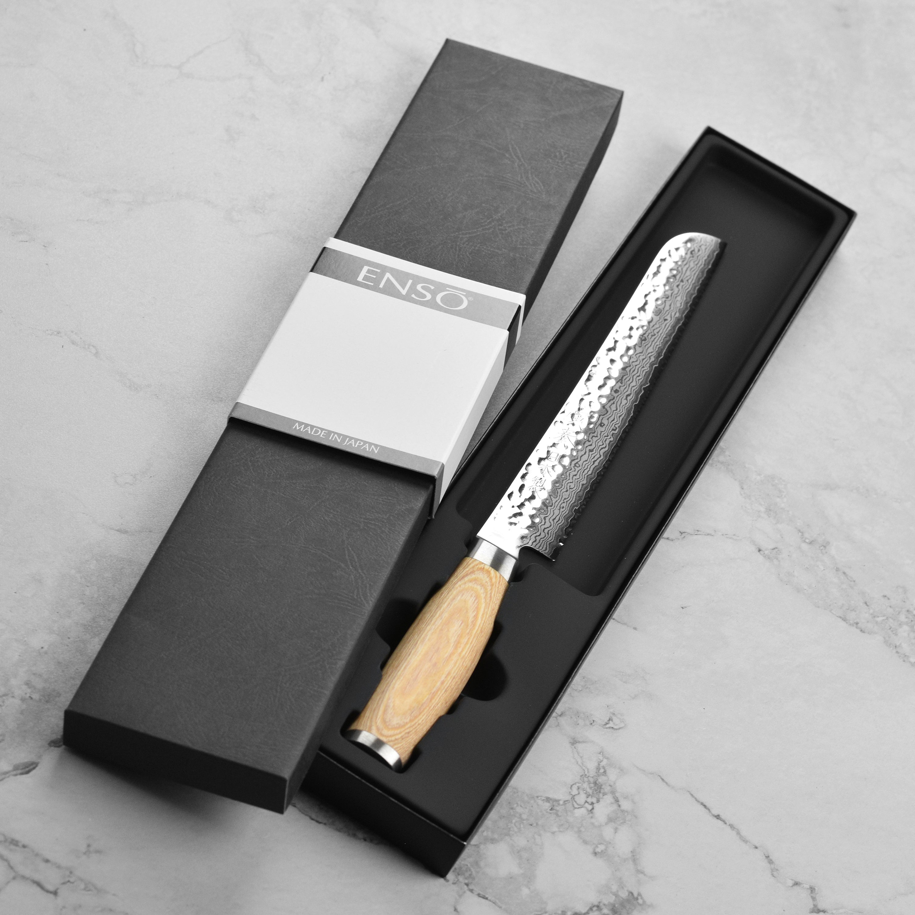 Handcrafted Japanese kitchen knife with pakkawood handle and engraved end cap