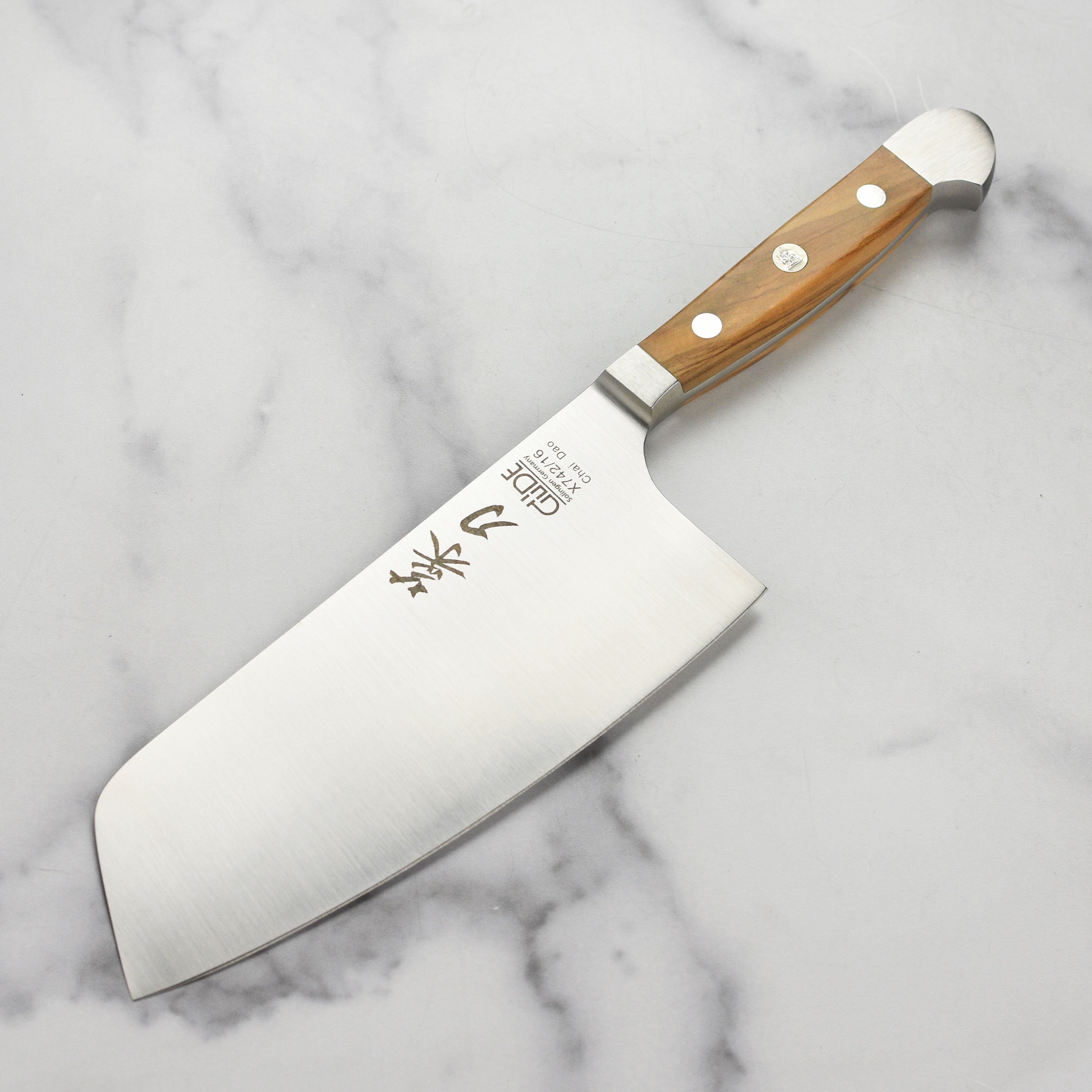 Gude Alpha Olive 6-inch Chai Dao knife with ergonomic handle and sharp blade, ideal for home cooking