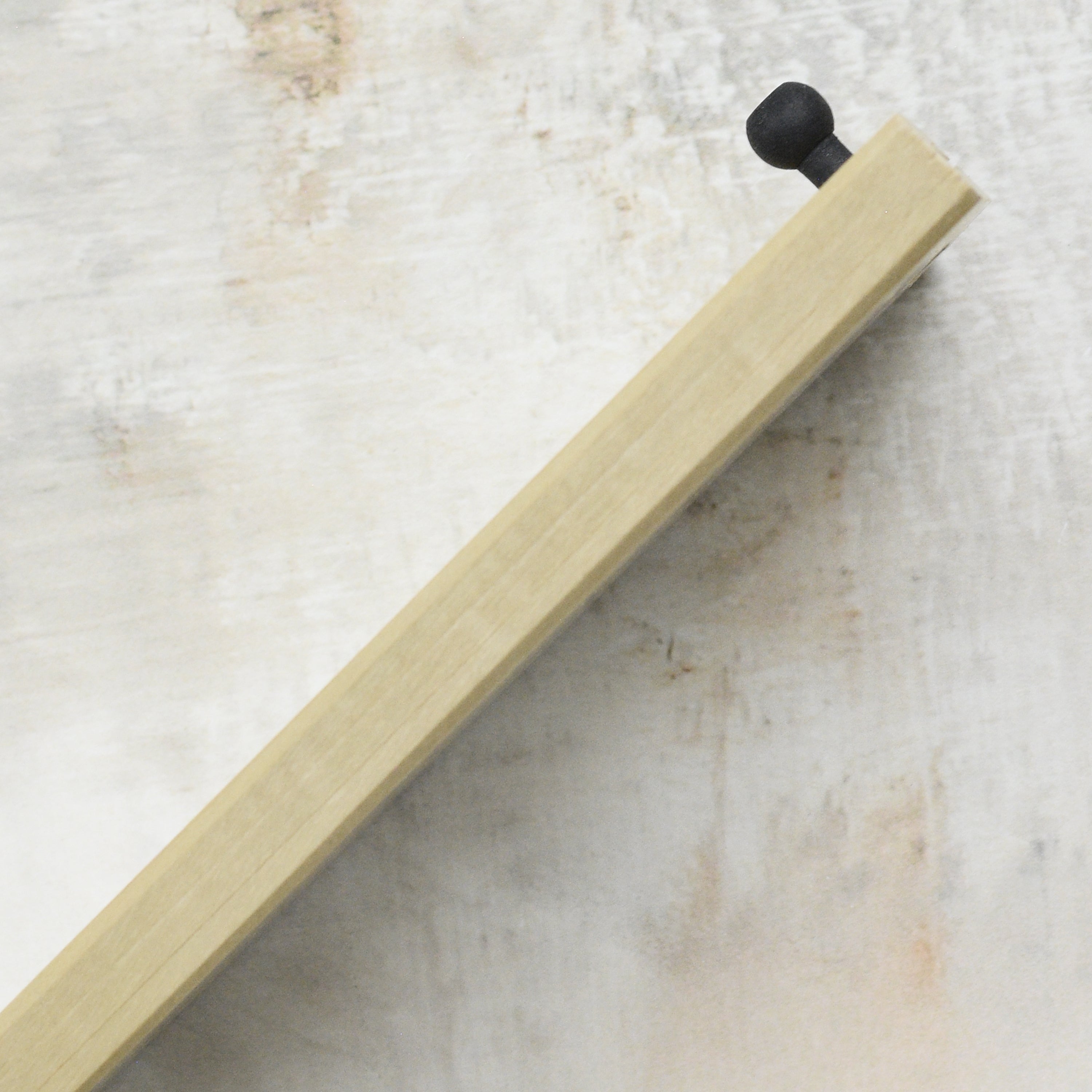 Kurosaki Saya 9.4-inch Sujihiki sheath covering a Japanese kitchen knife