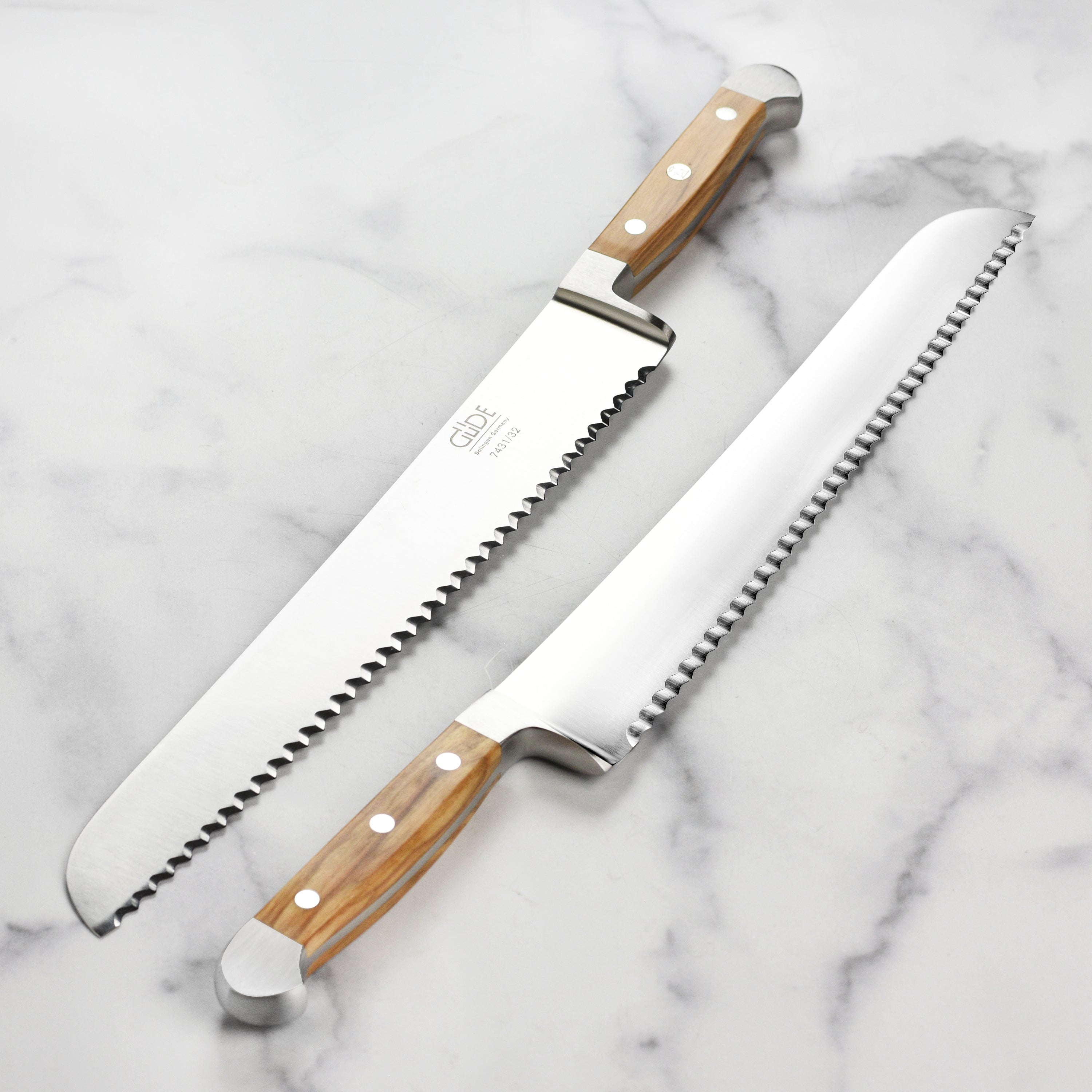 Chef slicing crusty bread with the ambidextrous bread knife, highlighting ergonomic design
