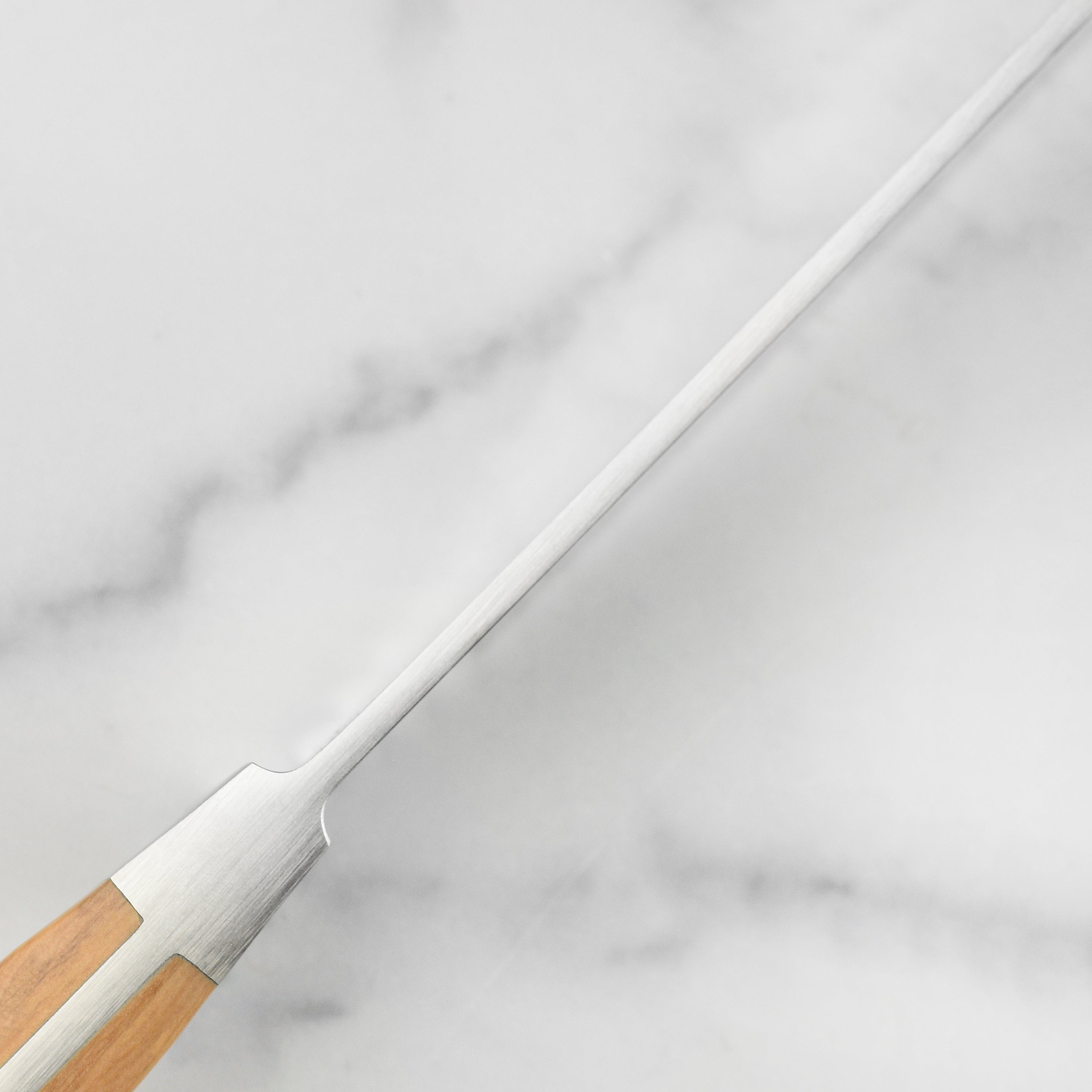 Elegant olive wood handle on the Franz Gude bread knife, handcrafted in Germany