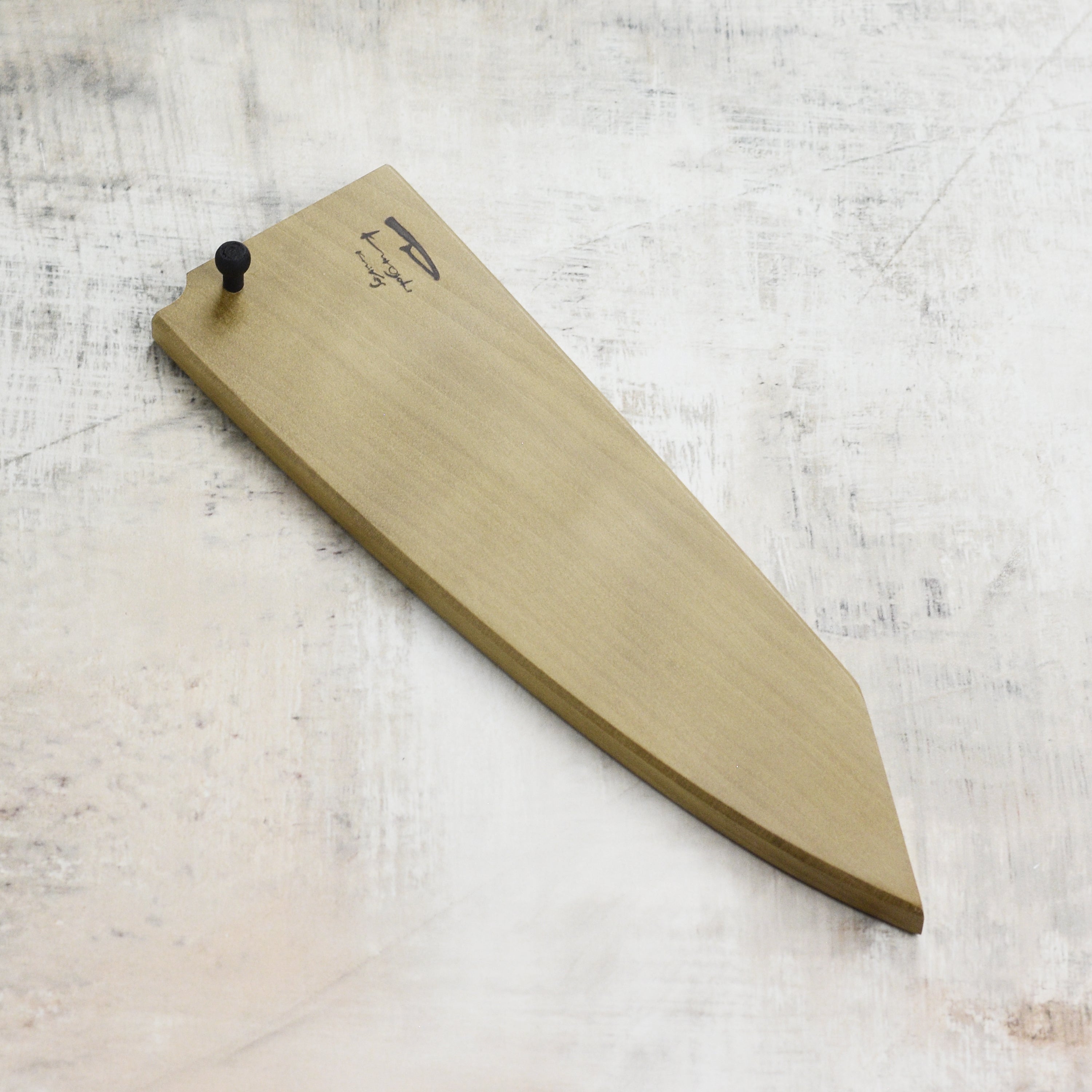 Kurosaki Bunka knife in a Japanese knife Saya, top view