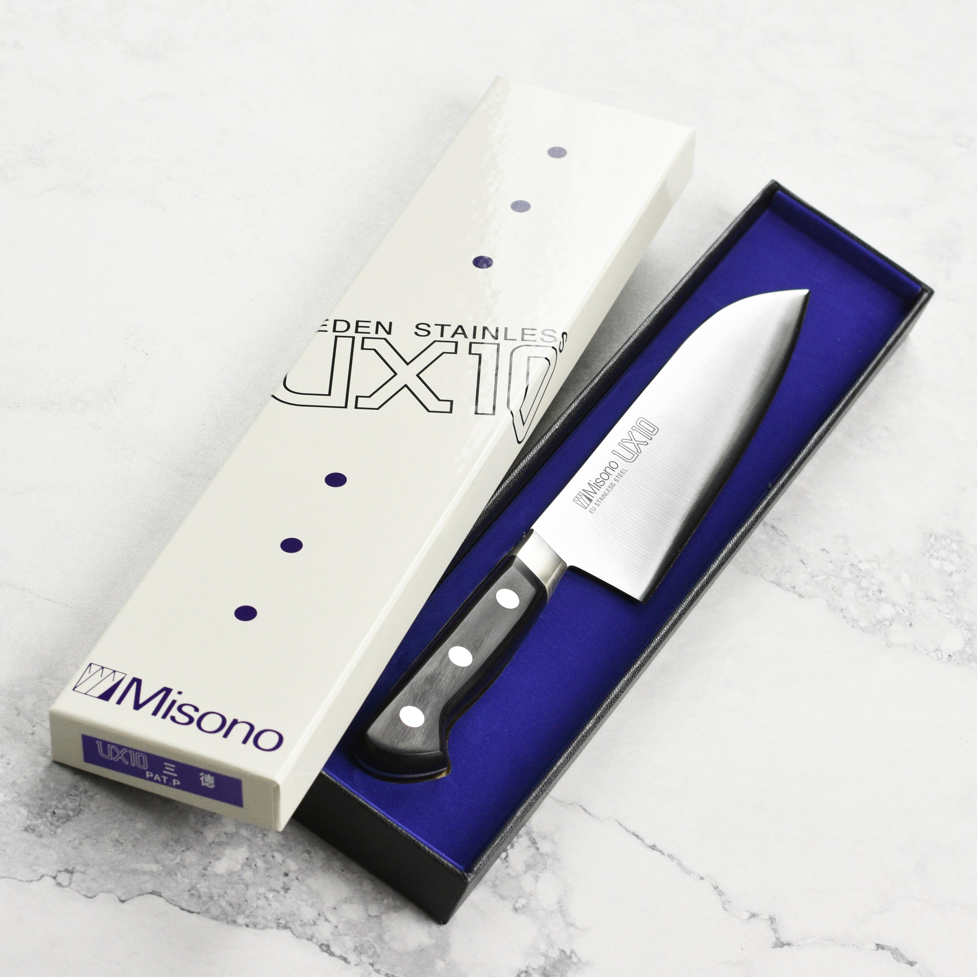 Misono UX10 Santoku knife showing the hand-forged blade and laminated black wood handle from a side angle.