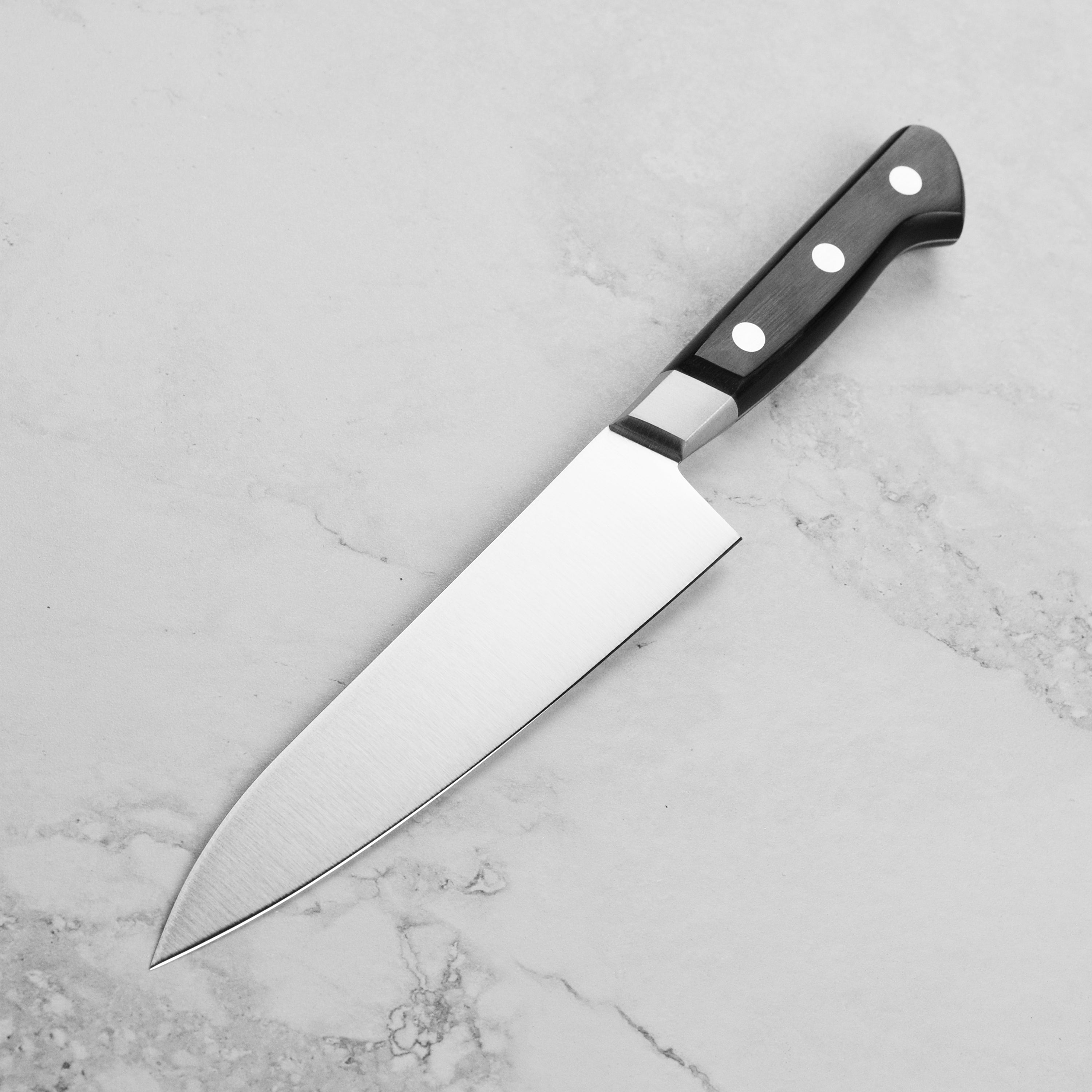 Display of the Misono UX10 knife with its sheath, highlighting the craftsmanship and materials.