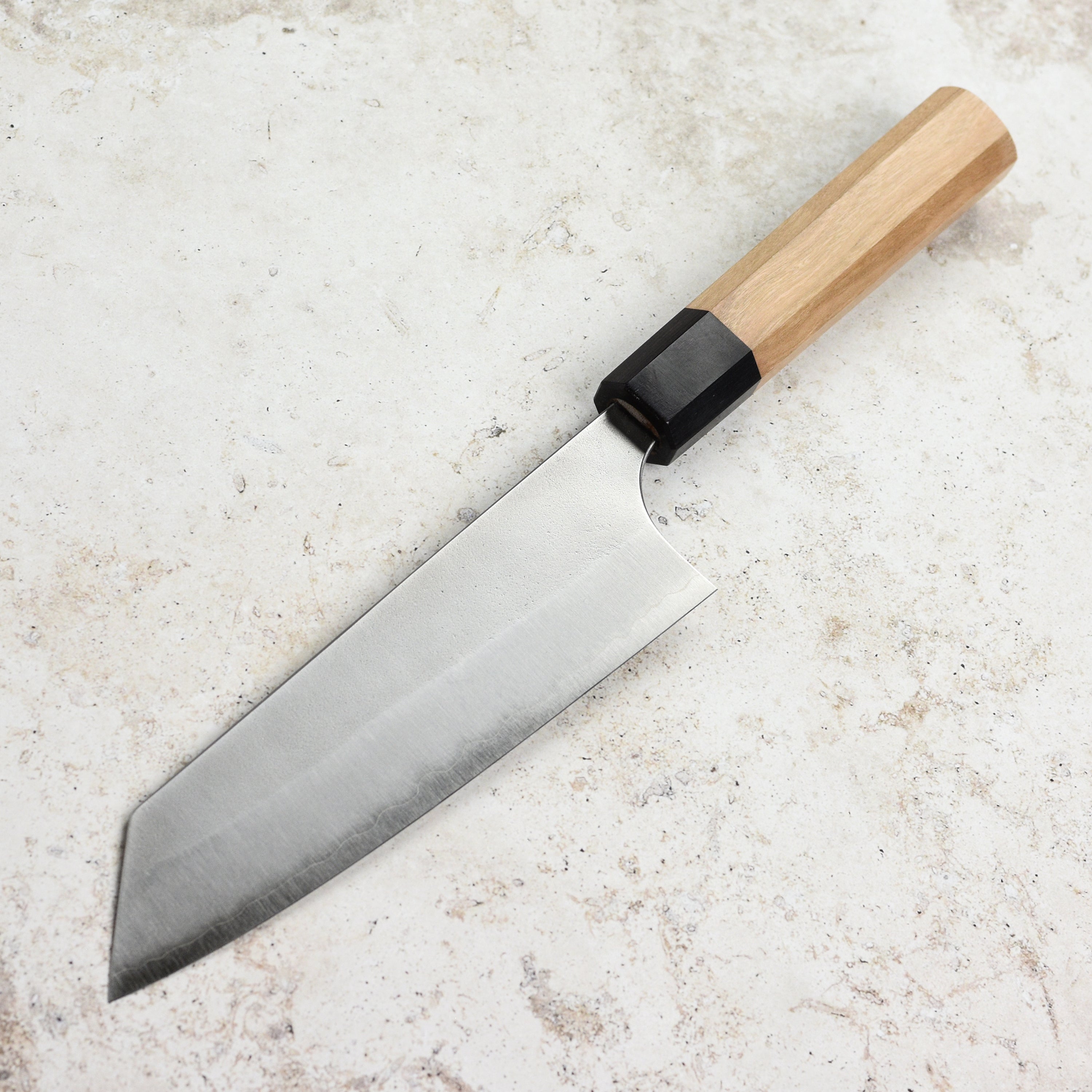 Close-up of the Aogami Super Nashiji Bunka knife showcasing its sharp blade and elegant design.