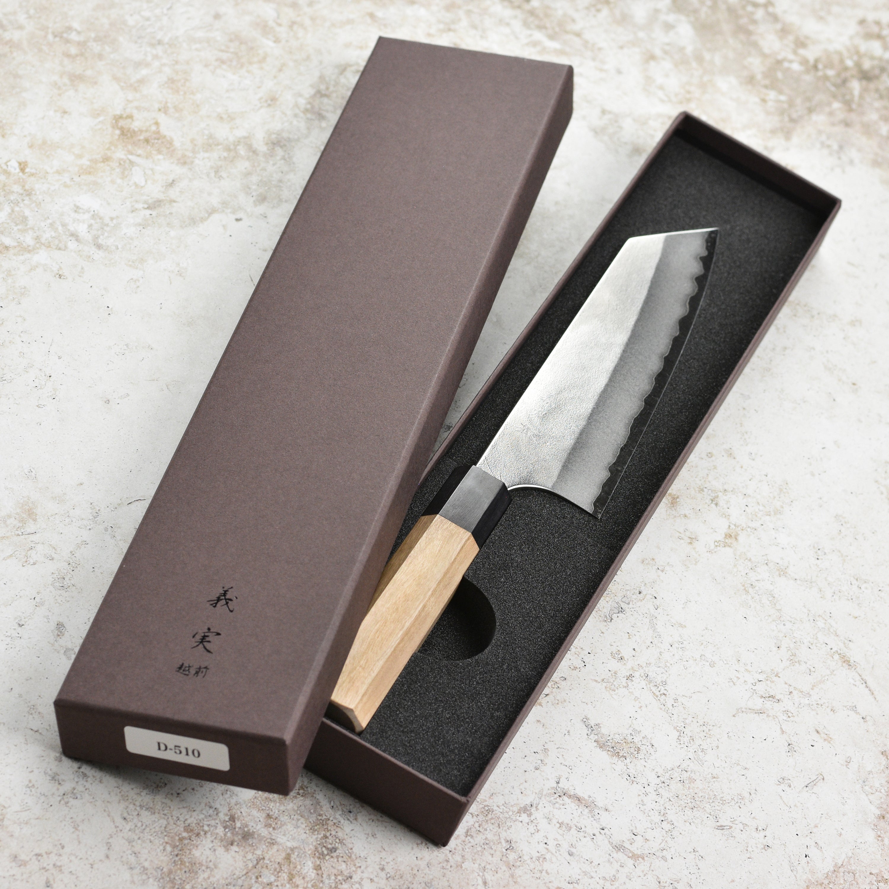Close-up of the Aogami Super Nashiji Bunka knife showcasing its sharp blade and elegant design.