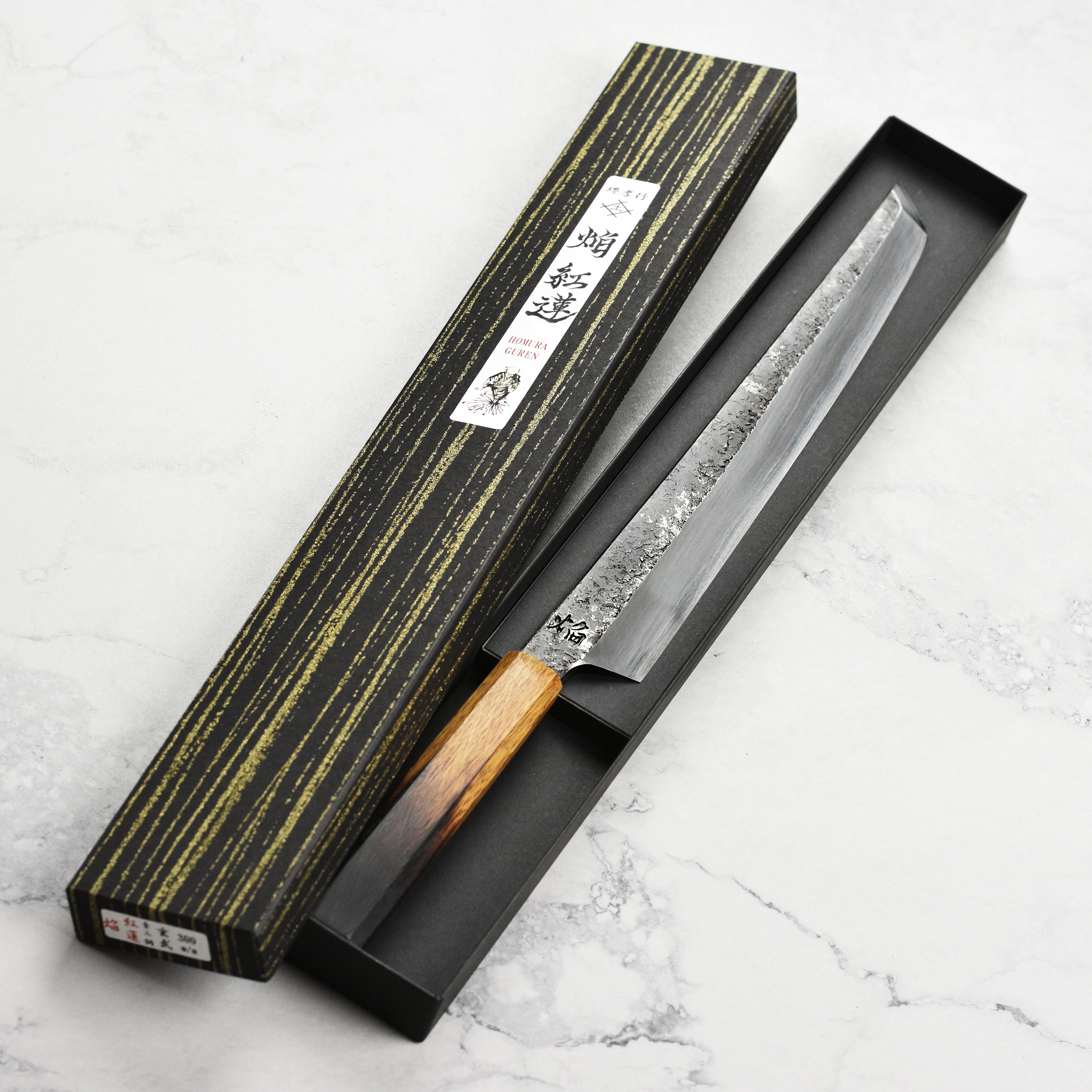 Takayuki Aogami #2 Single Bevel Knife showcasing its sharp blade and elegant handle from a top angle.
