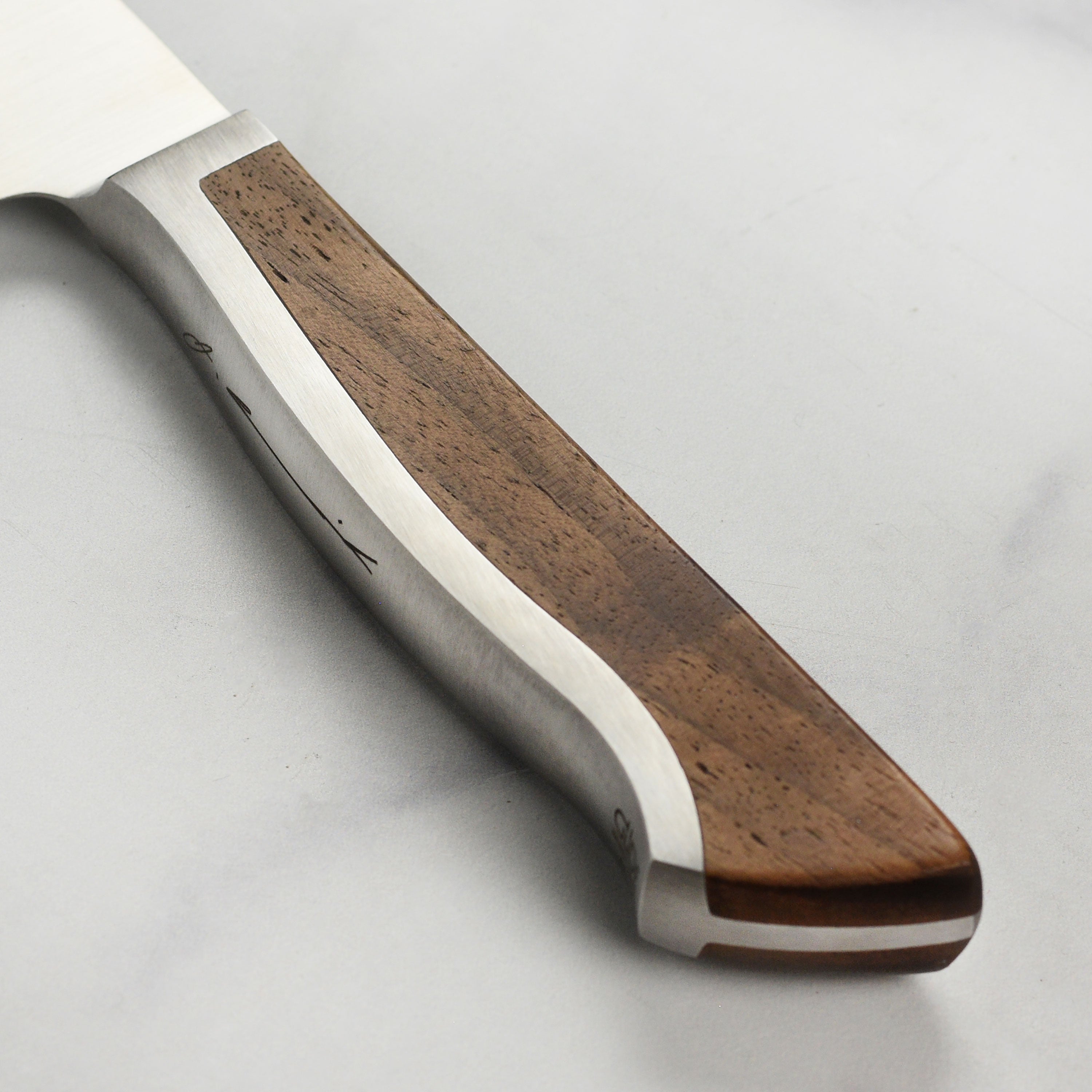 Close-up of the high carbon steel blade of the Gude Caminada knife.