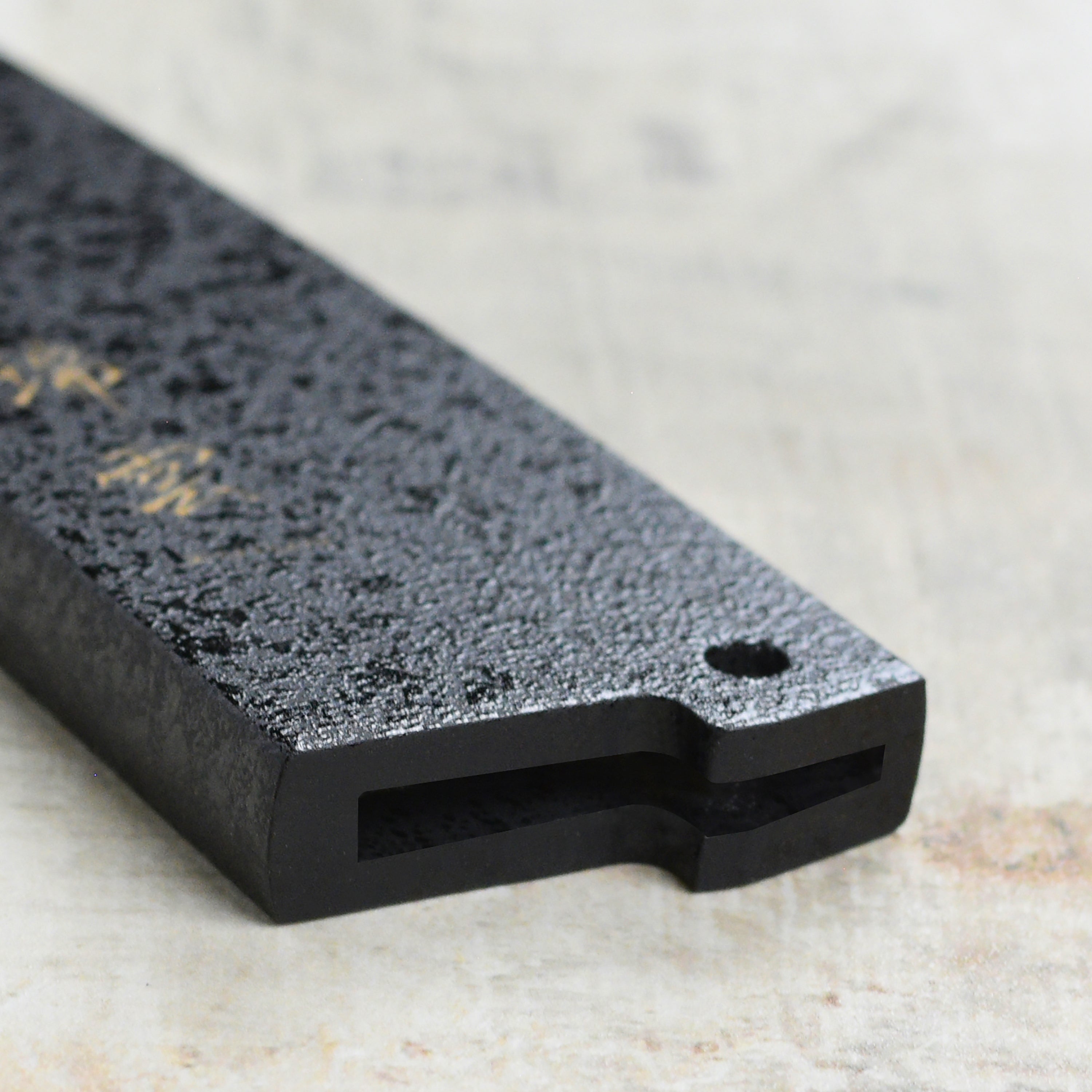 Display of the Zuiun 5.9" petty knife saya in a kitchen setting, demonstrating its elegant design and functionality.