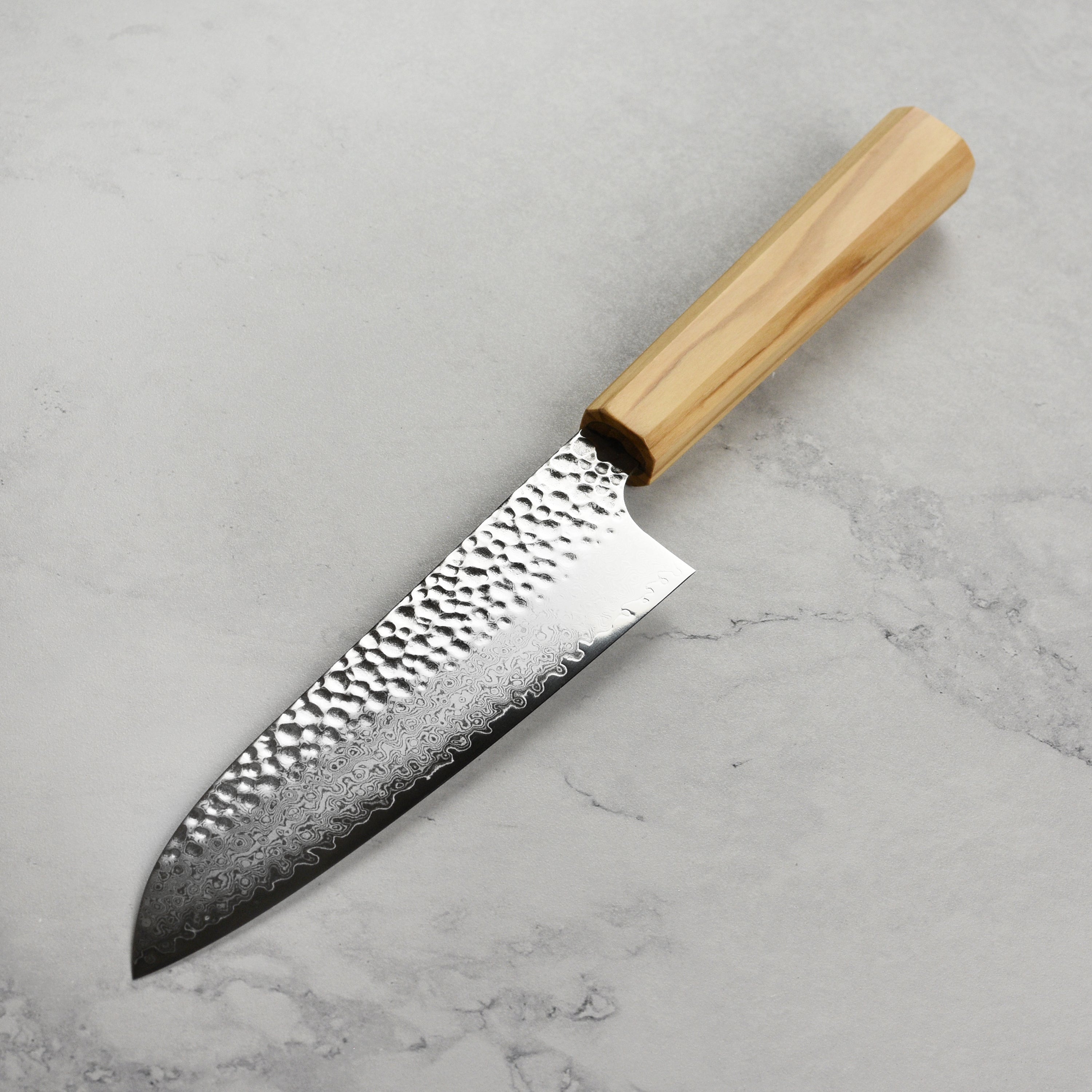 Close-up of the Enso Olivewood handle, emphasizing the quality and design for chefs.