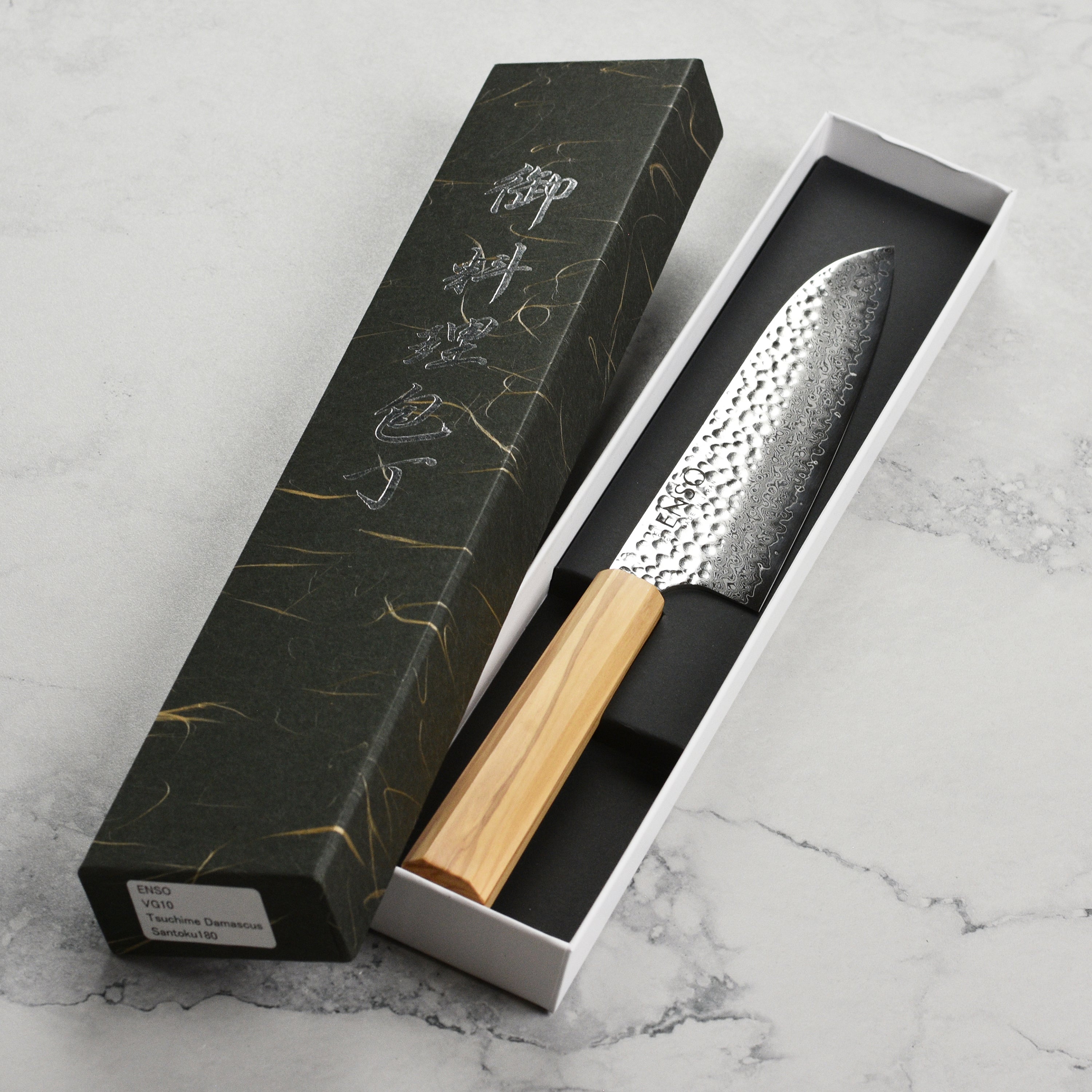Enso Olivewood Santoku knife from above, highlighting the blades sharpness and craftsmanship.