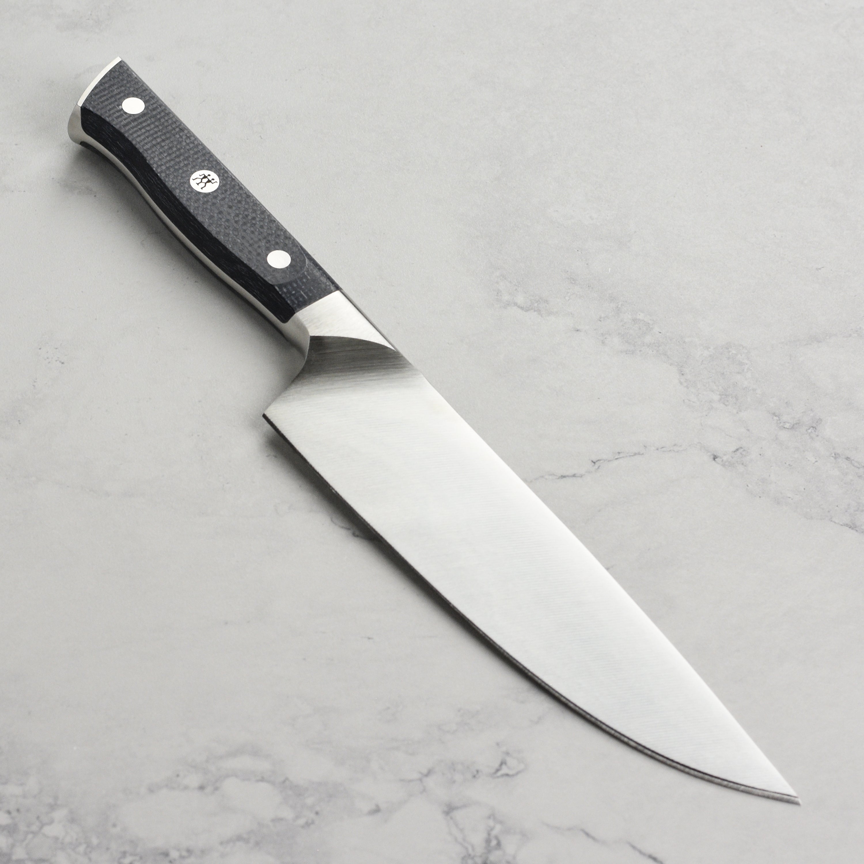 Chef using the Zwilling Spectrum knife for slicing vegetables with ease