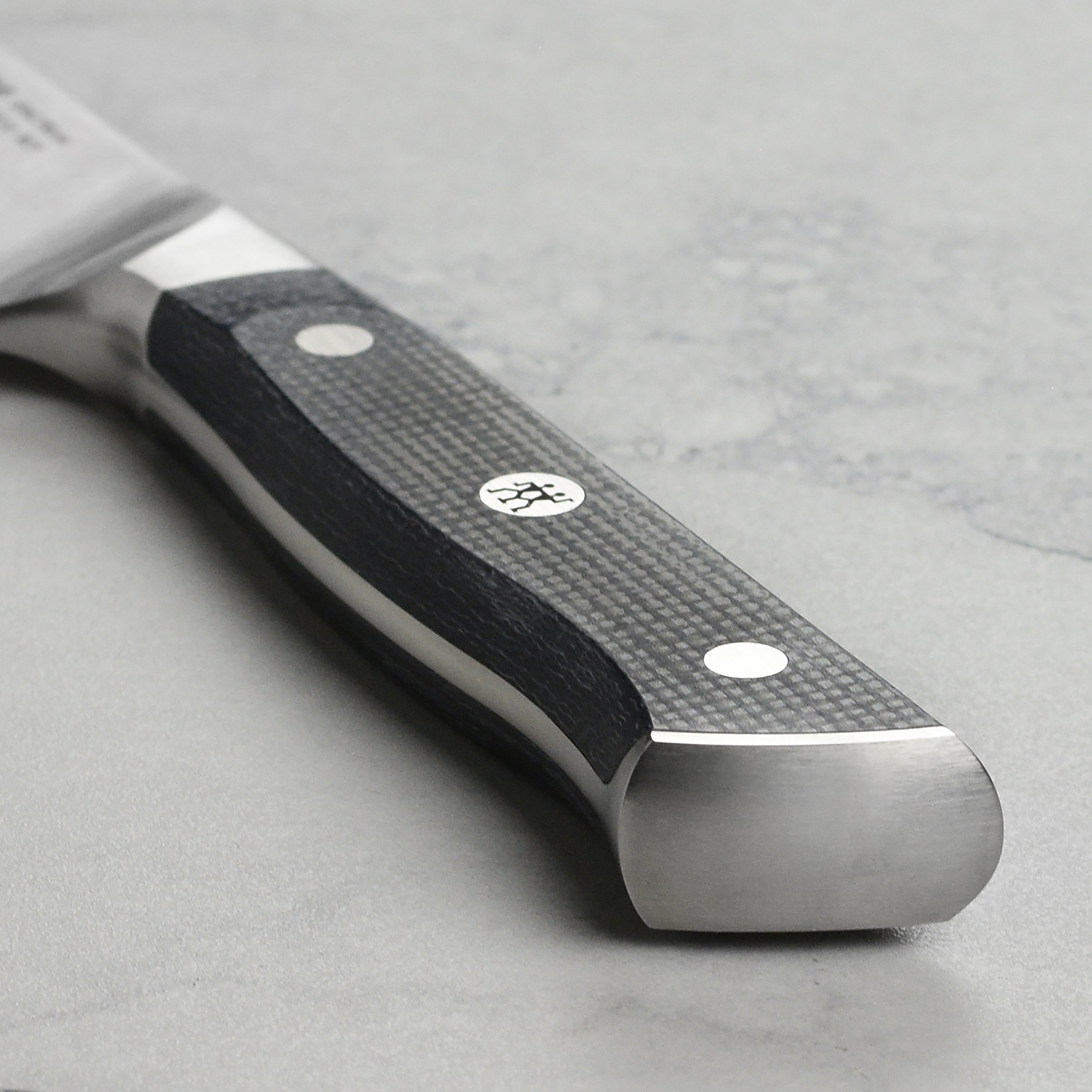 Close-up of the high carbon steel blade and full tang construction of Zwilling knives