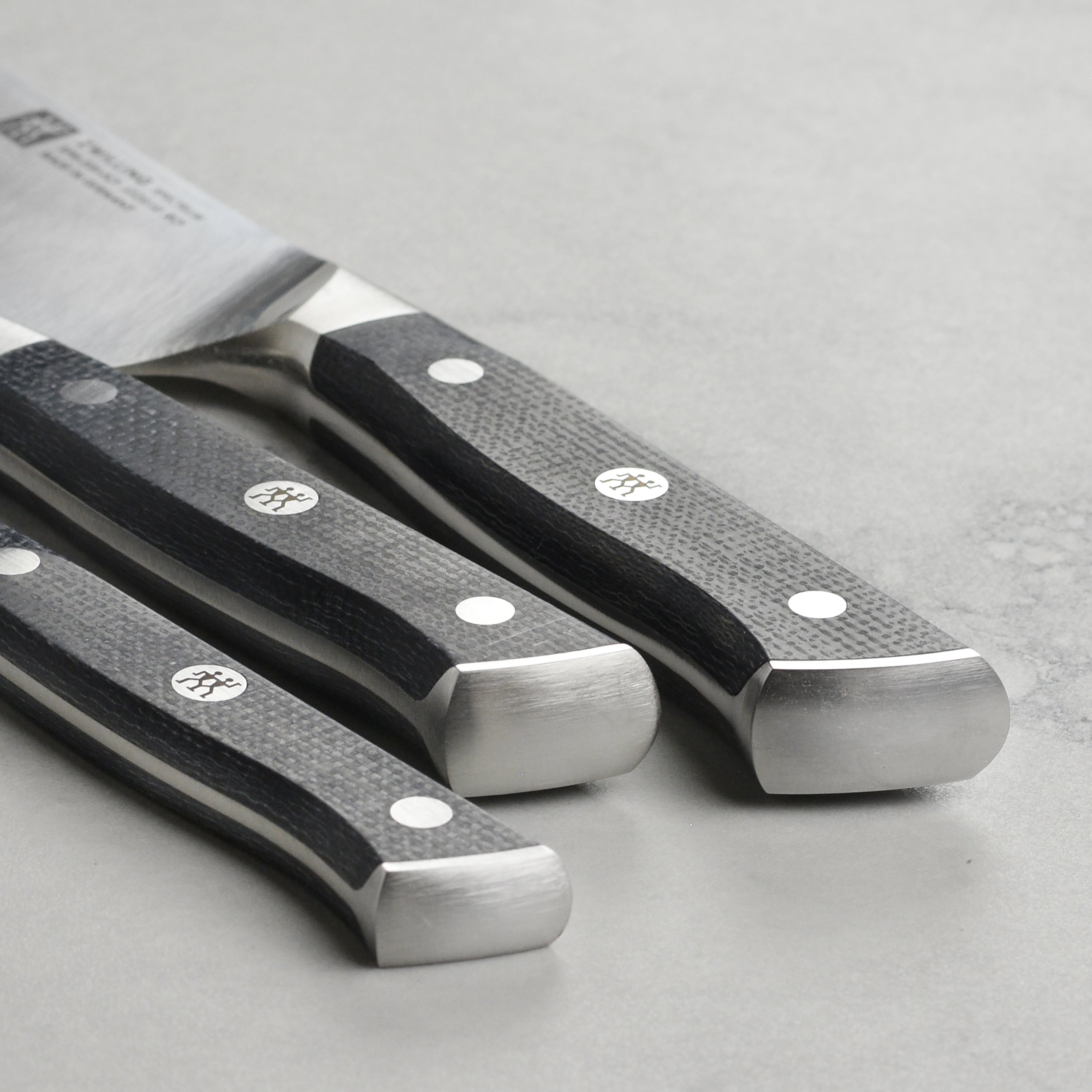 Kitchen knife set featuring Zwilling Spectrum knives with durable handles and sharp blades