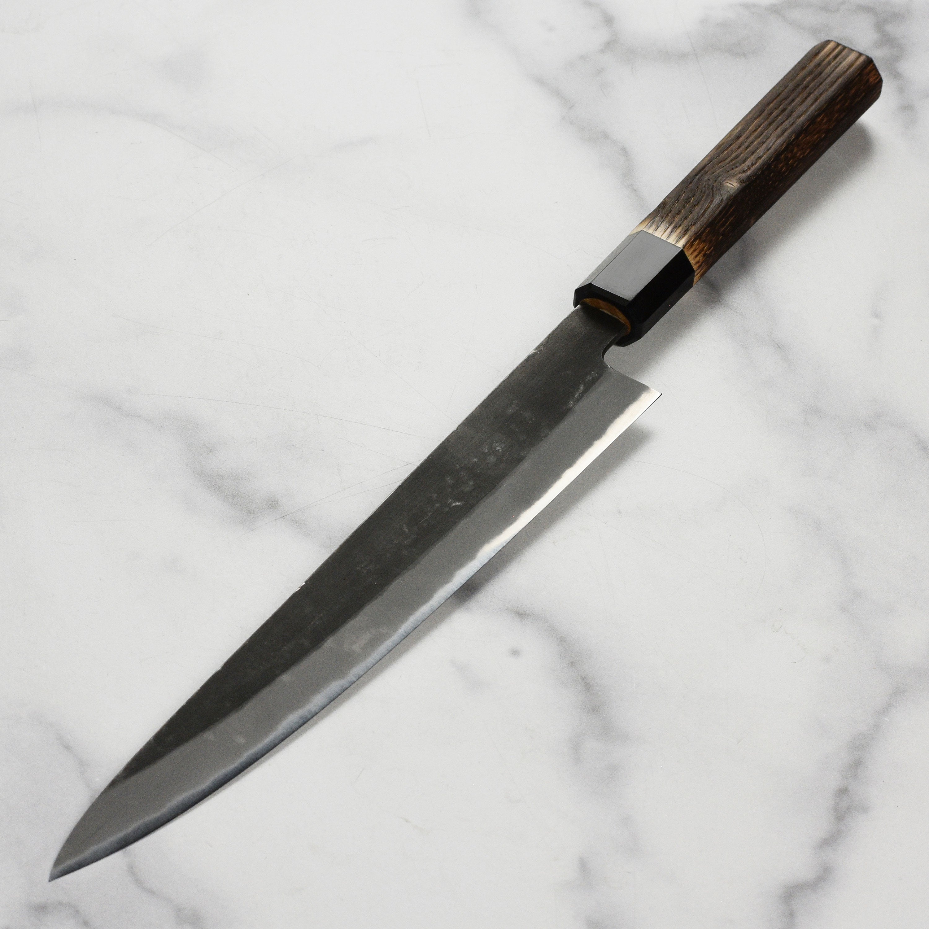 Hinoura Premium Sujihiki Knife in action, slicing fresh sashimi.