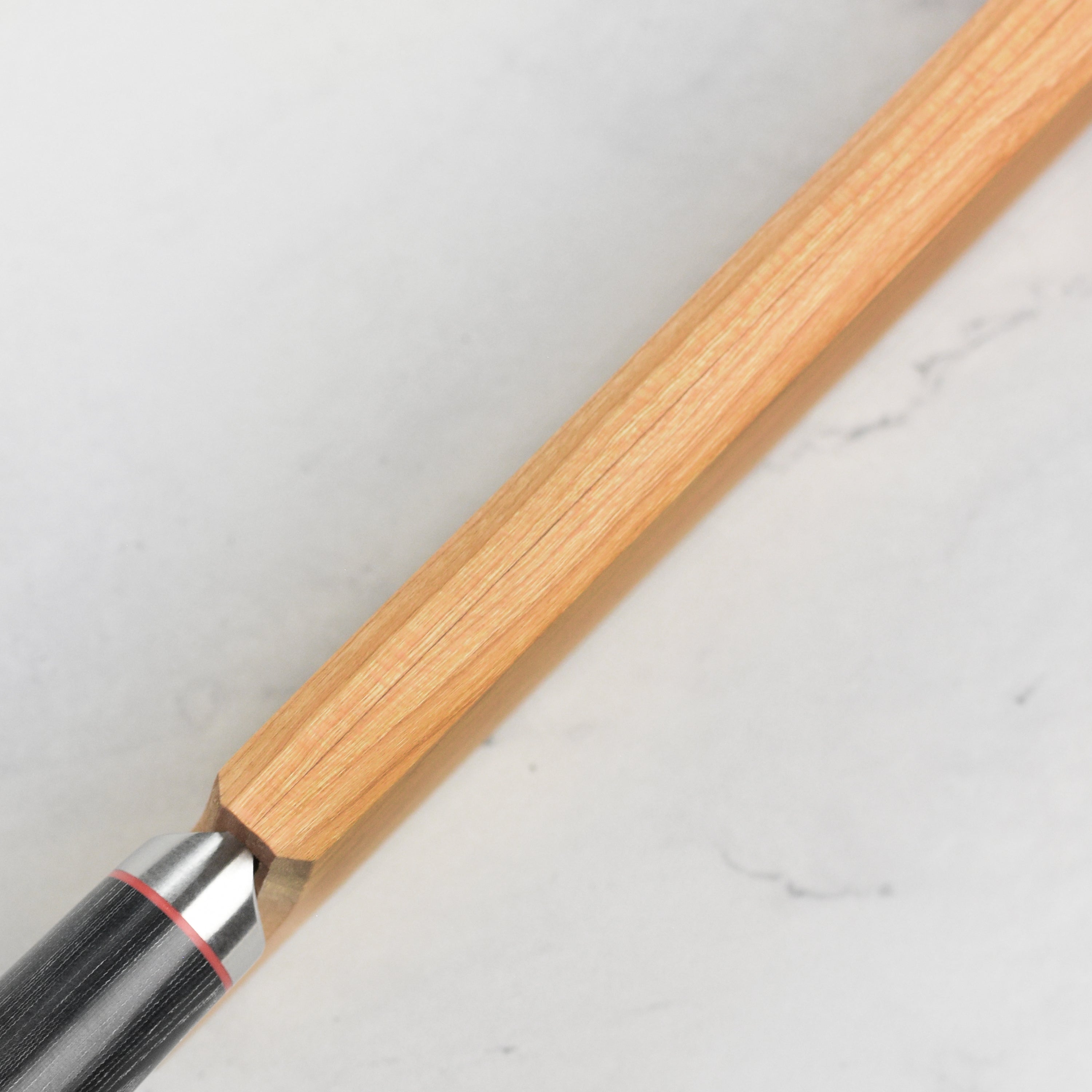 Close-up of the cherry wood knife sheath, emphasizing the smooth surface and perfect fit for various chefs knives.