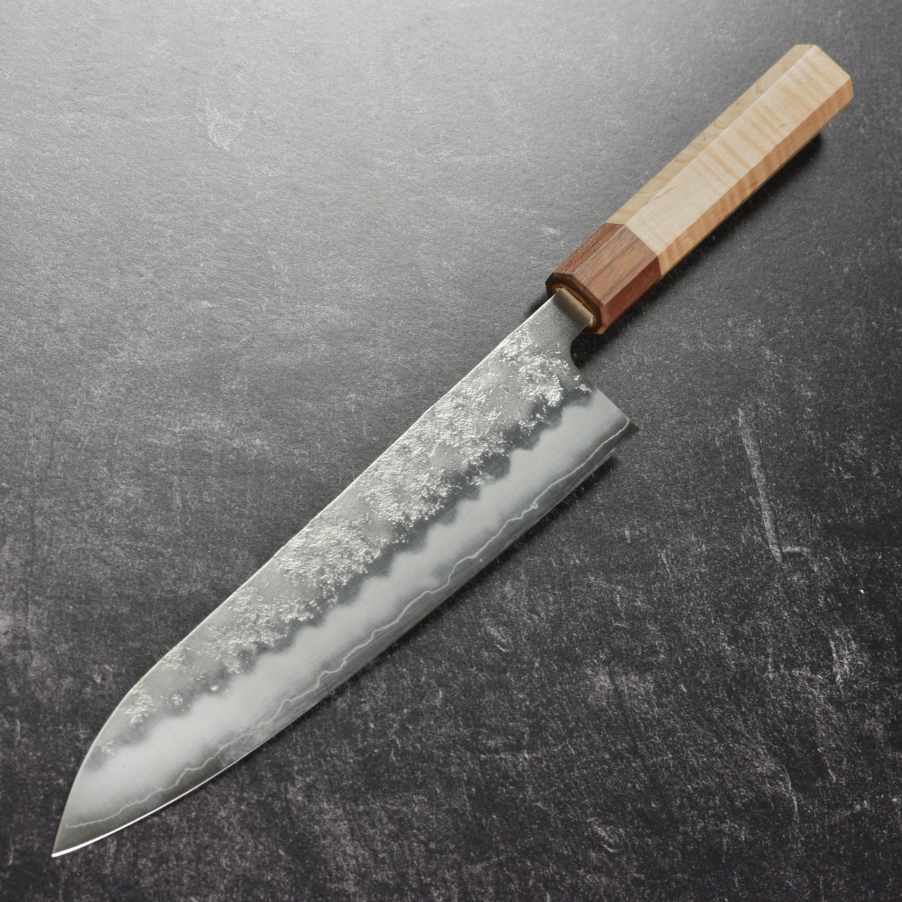 Close-up of the ergonomic handle of the Ittetsu Ginsan Nashiji Gyuto knife.