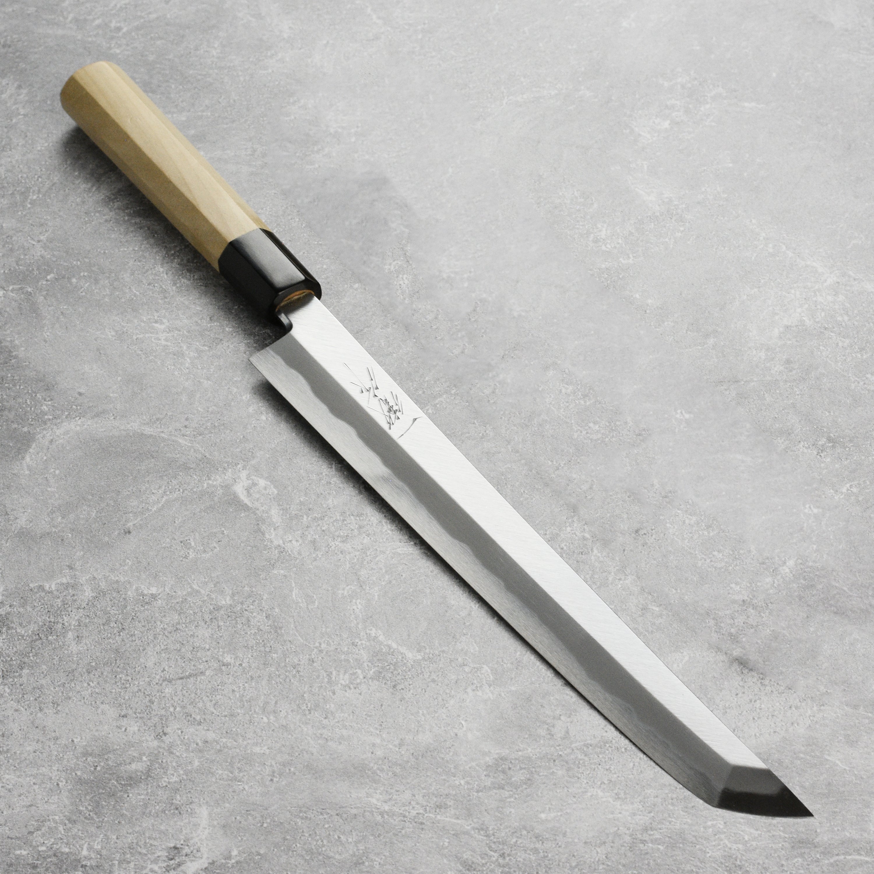 Tanaka Shirogami #2 Sakimaru Takohiki knife displayed with saya for precision slicing.
