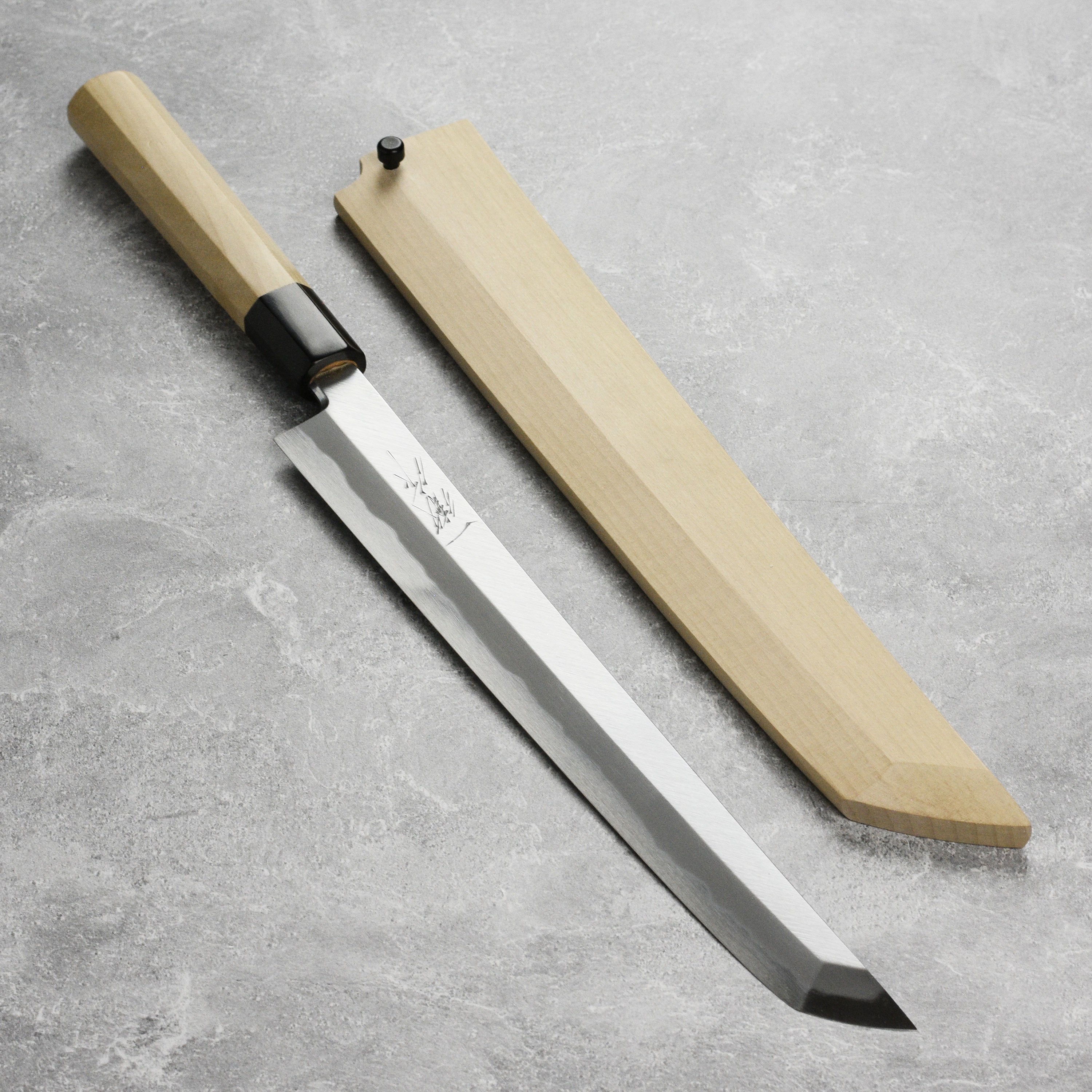 Tanaka Shirogami #2 Sakimaru Takohiki knife displayed with saya for precision slicing.