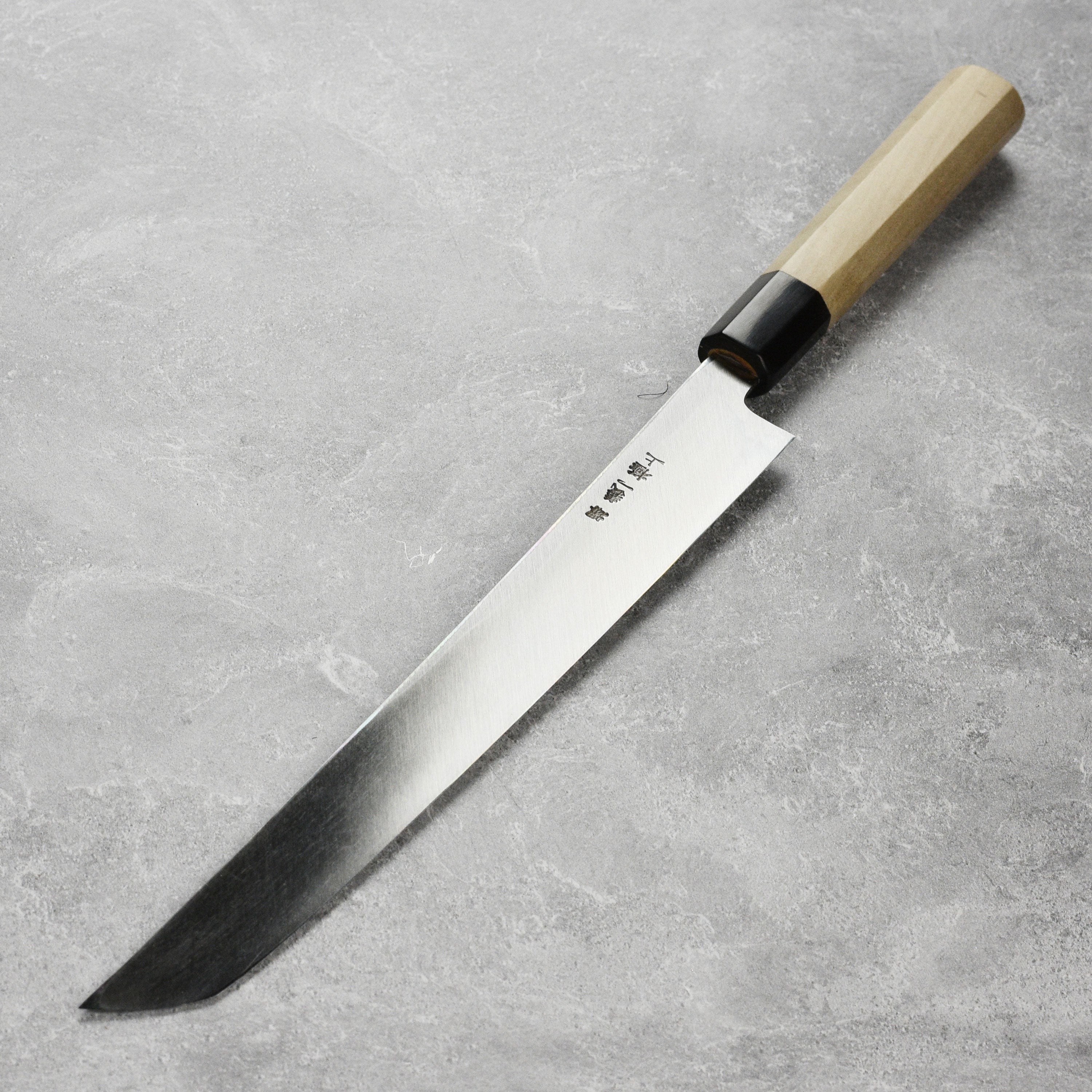 Tanaka Shirogami #2 Sakimaru Takohiki knife displayed with saya for precision slicing.