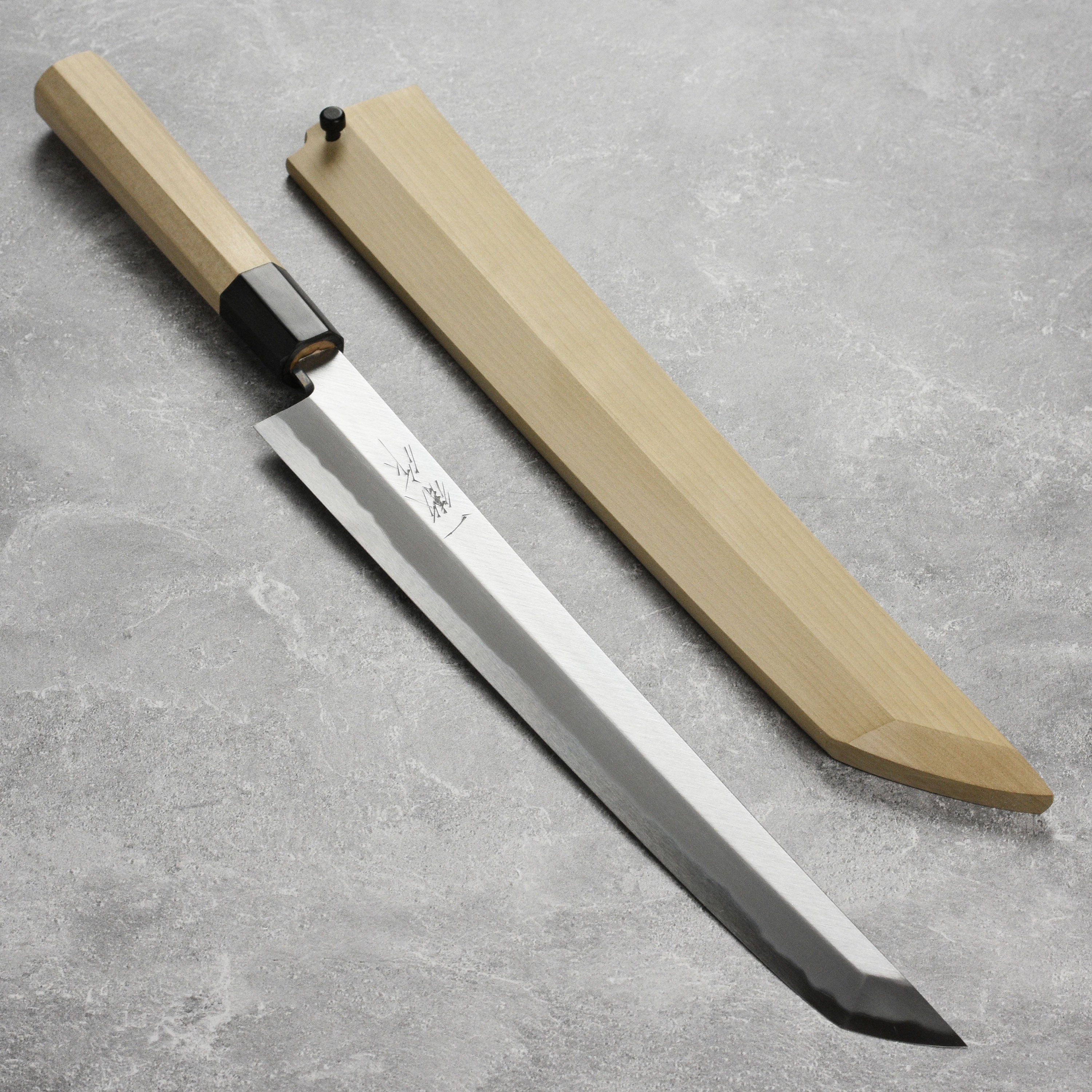 Ittetsu Tanaka Shirogami Takohiki Knife showcasing its sleek design and craftsmanship.
