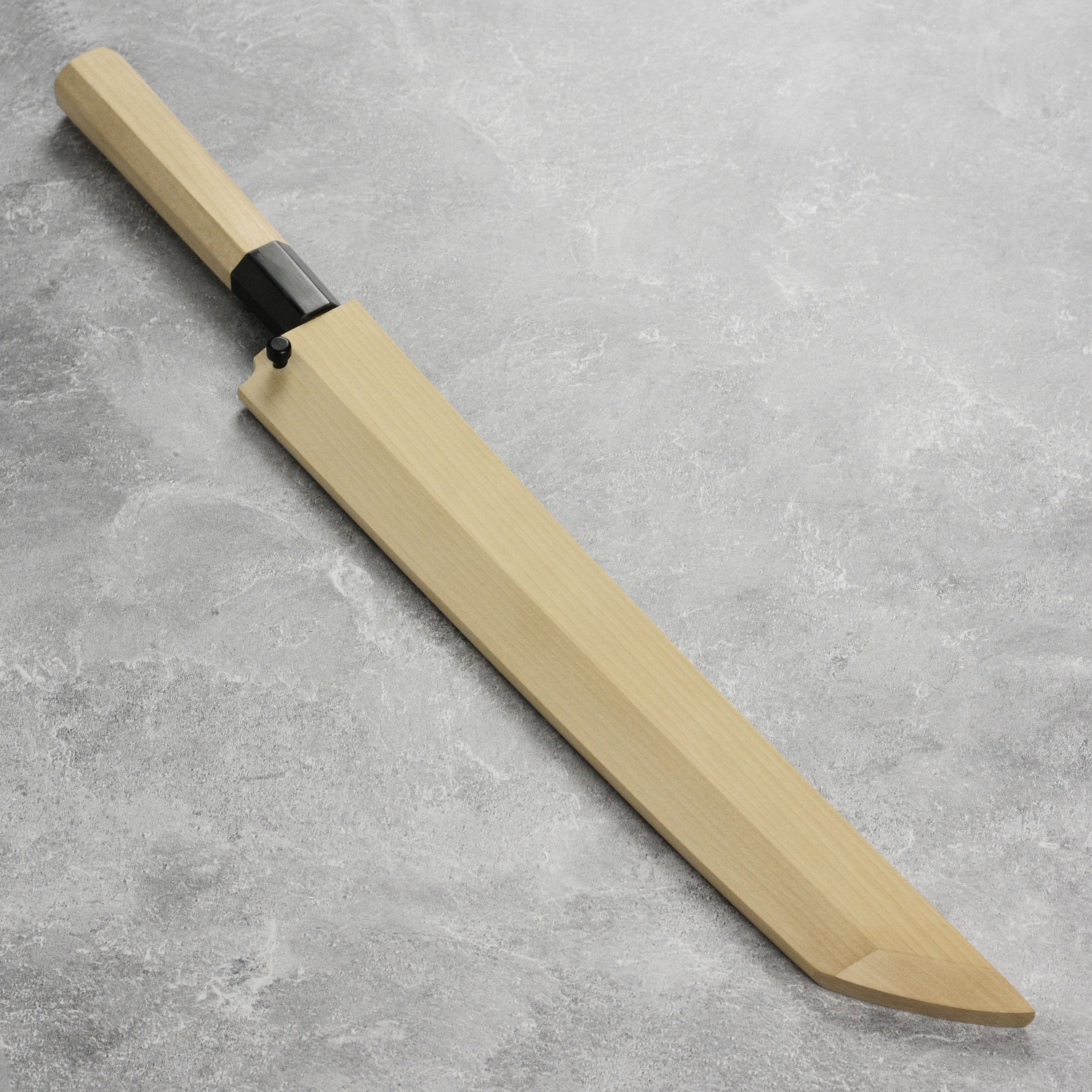 Close-up of the blade of the Takohiki knife displaying its sharp edge and Shirogami steel finish.