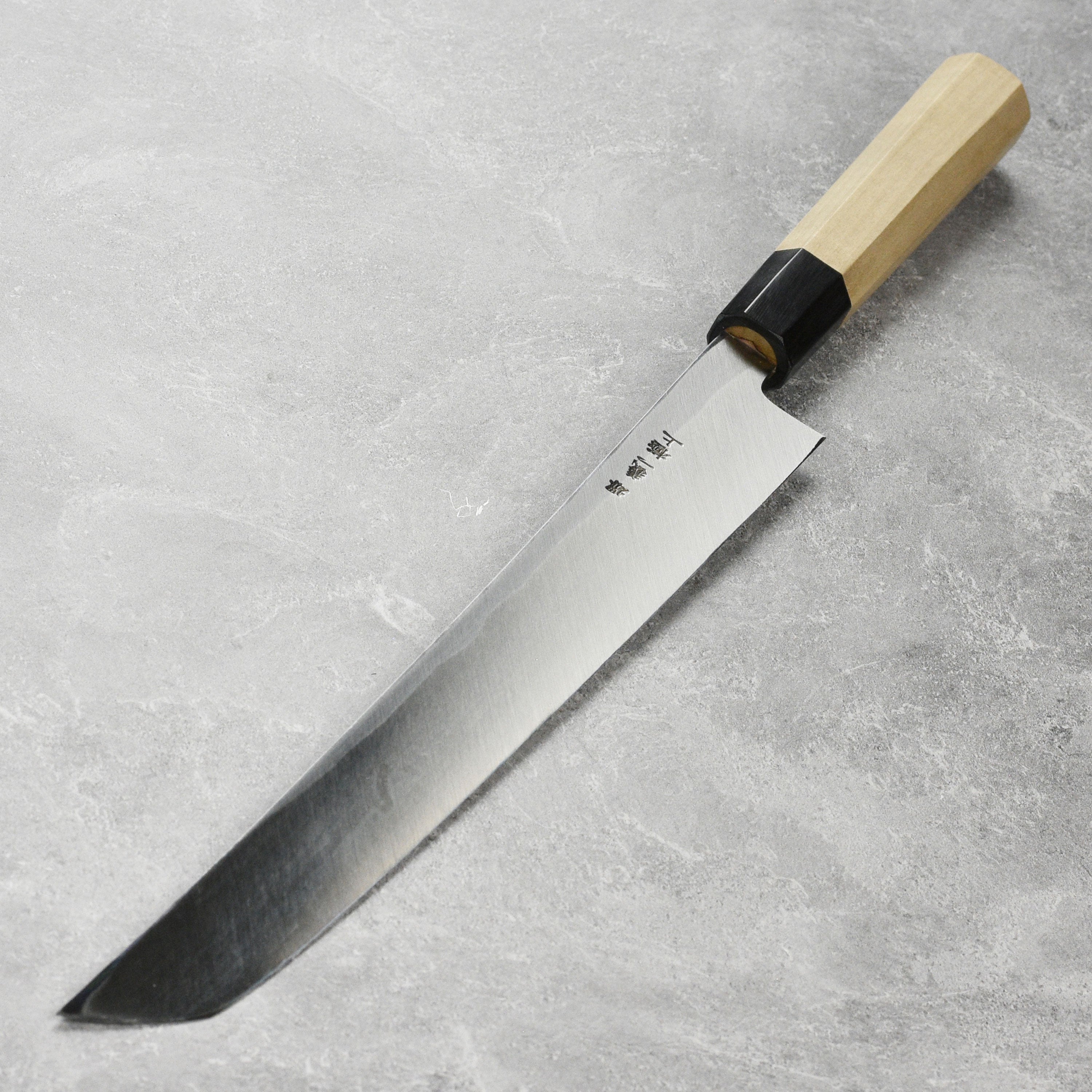Ittetsu Tanaka Shirogami Takohiki Knife showcasing its sleek design and craftsmanship.