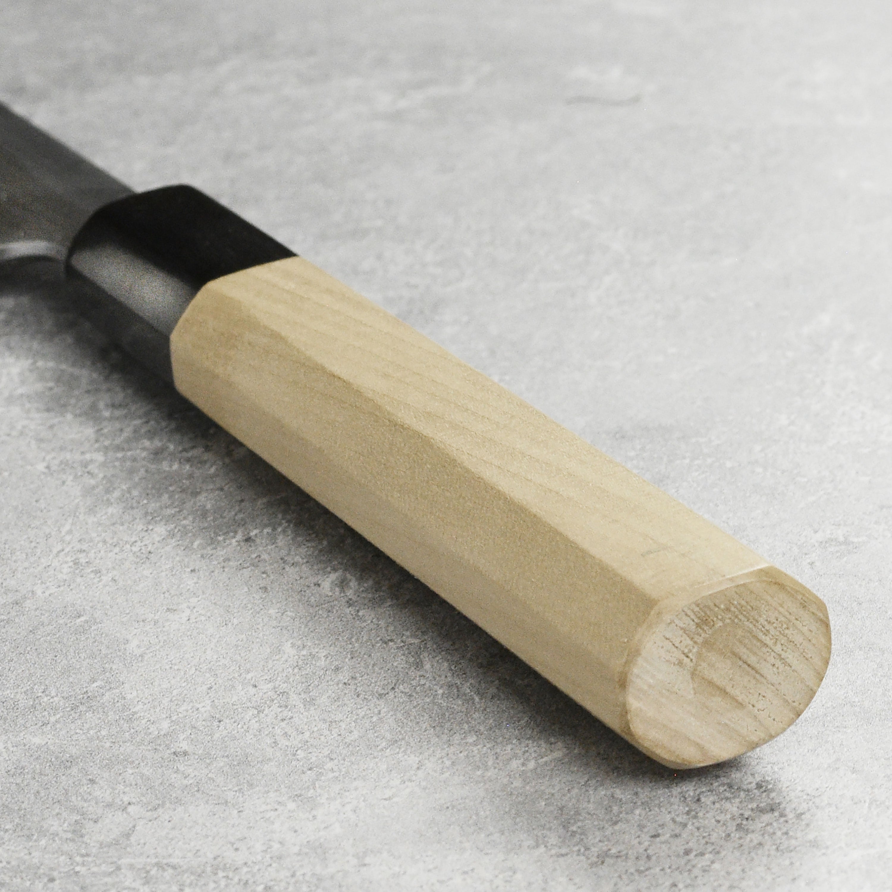 Close-up of the blade of the Takohiki knife displaying its sharp edge and Shirogami steel finish.