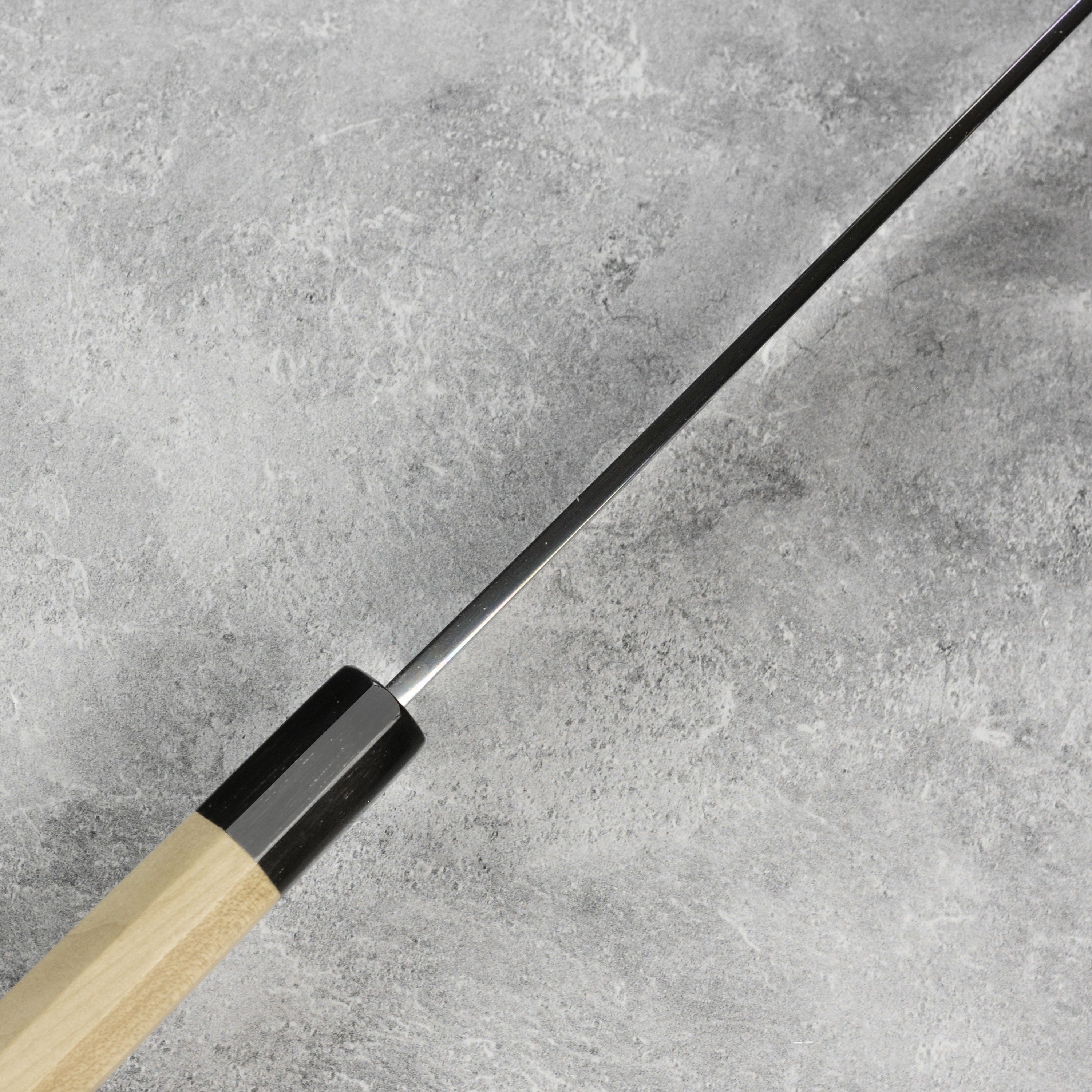 Close-up of the blade of the Takohiki knife displaying its sharp edge and Shirogami steel finish.