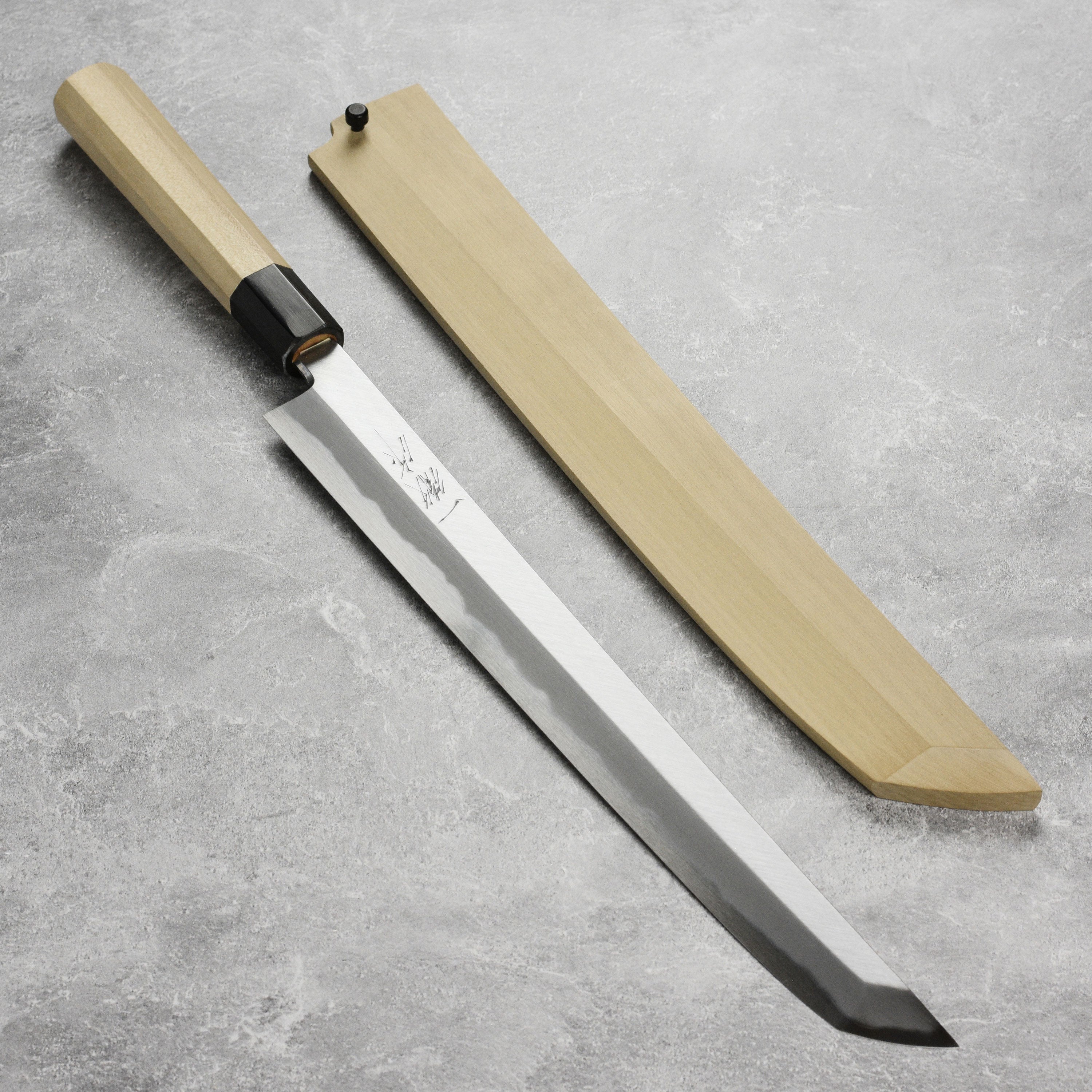Ittetsu Tanaka Sakimaru Takohiki knife showcasing its sleek design and sharp blade.