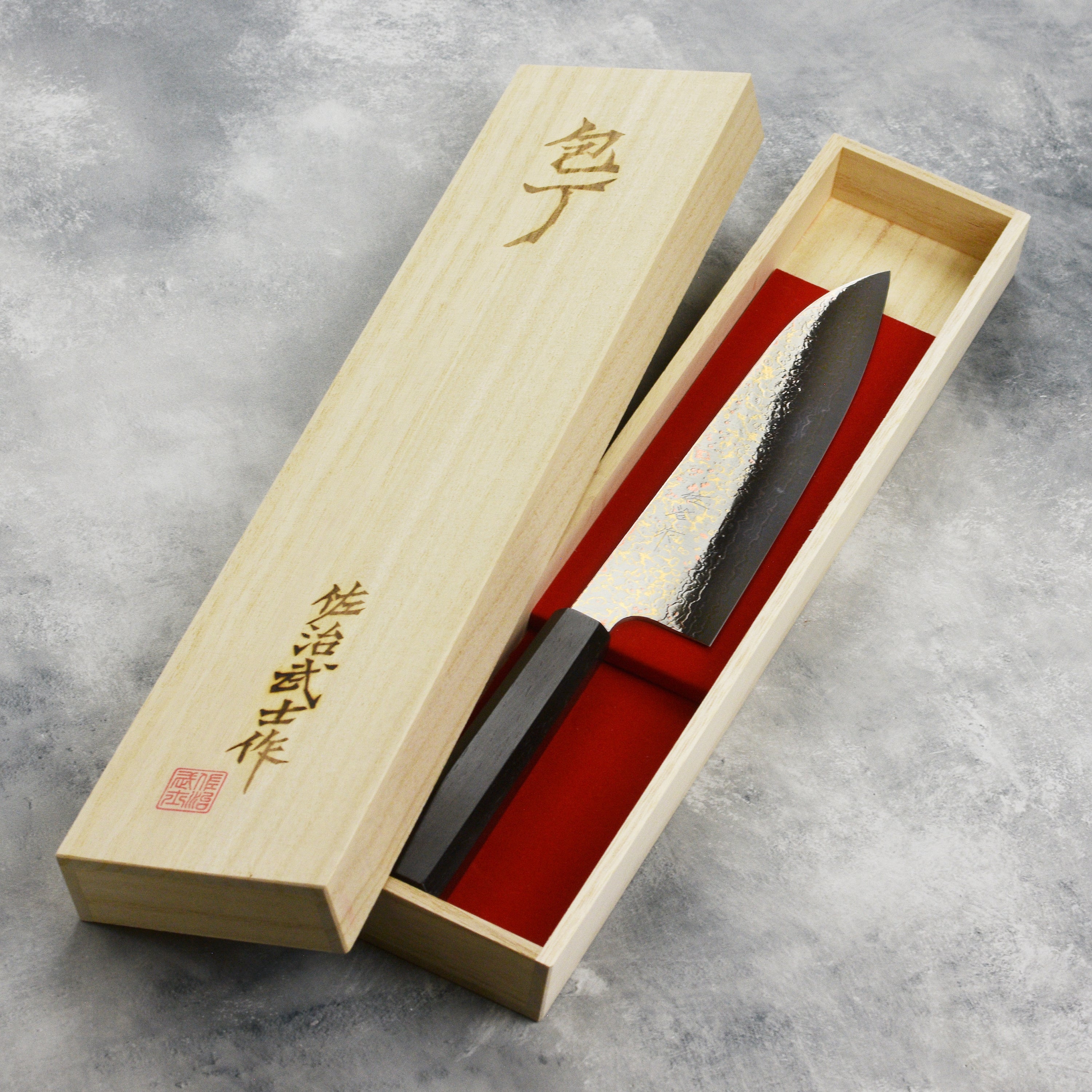 Close-up of the rainbow damascus gyuto knife blade highlighting layered steel and vibrant colors