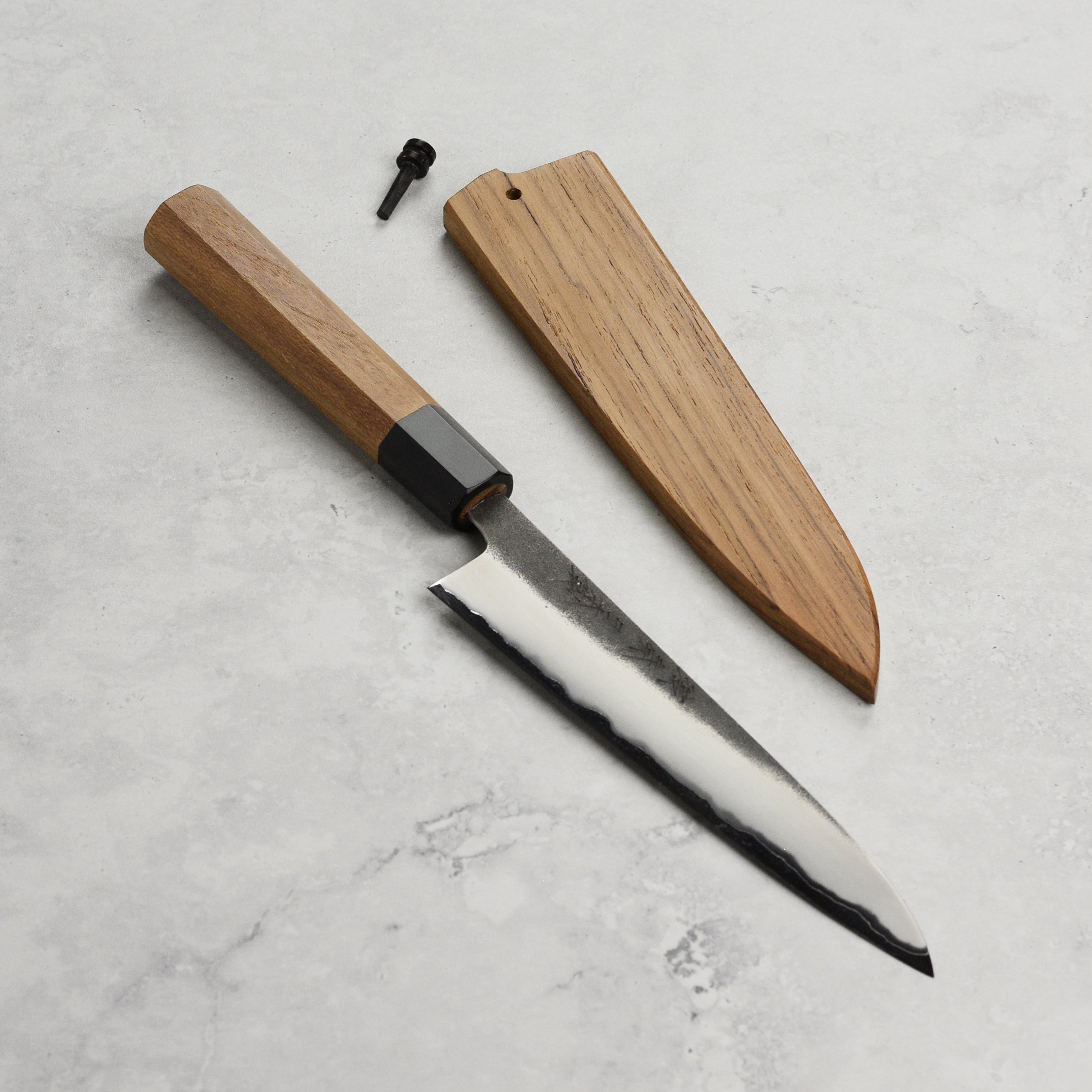 Close-up of the Enso hand-forged kitchen knife blade with kurouchi finish.