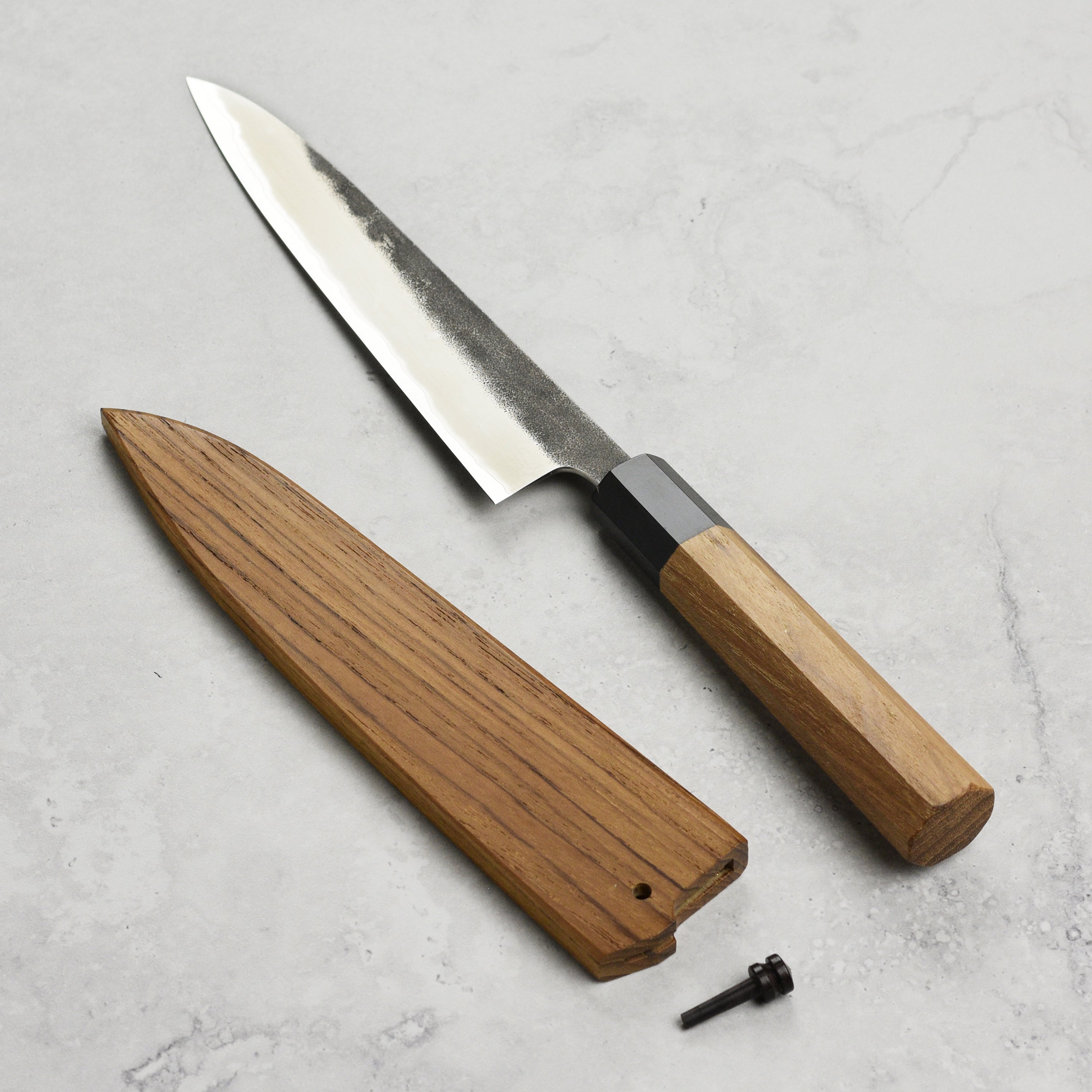 Enso Premium Japanese Culinary Petty Knife displayed with its handmade saya.