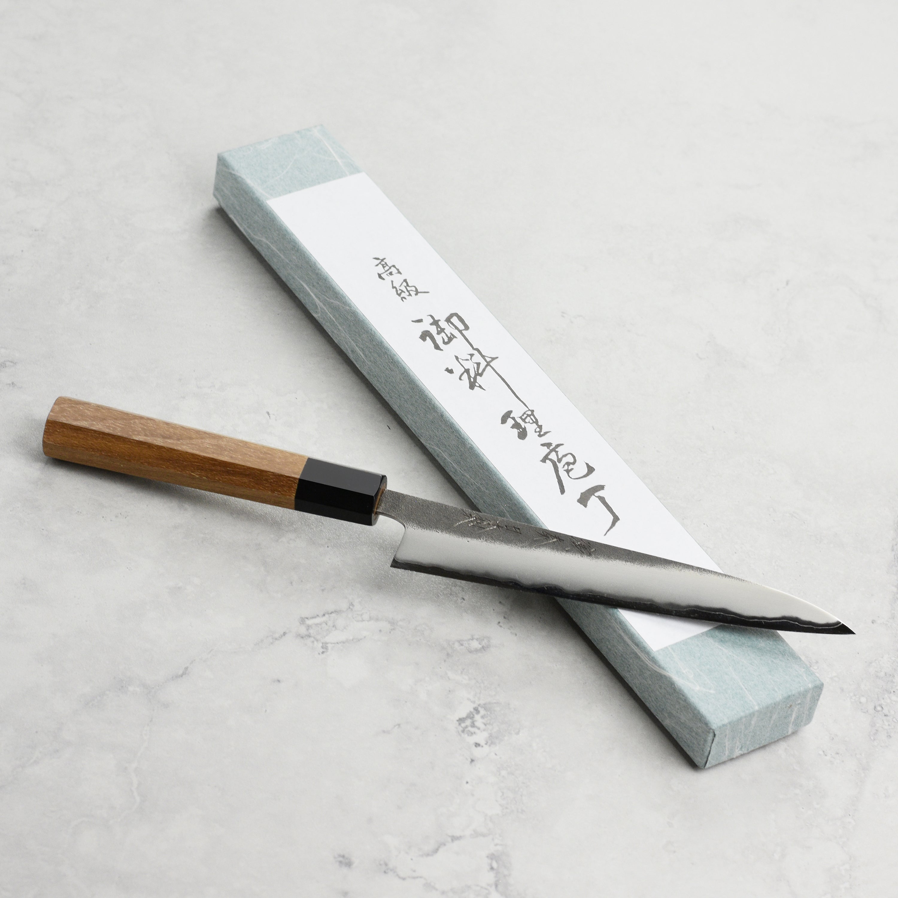 Close-up of the Enso hand-forged kitchen knife blade with kurouchi finish.