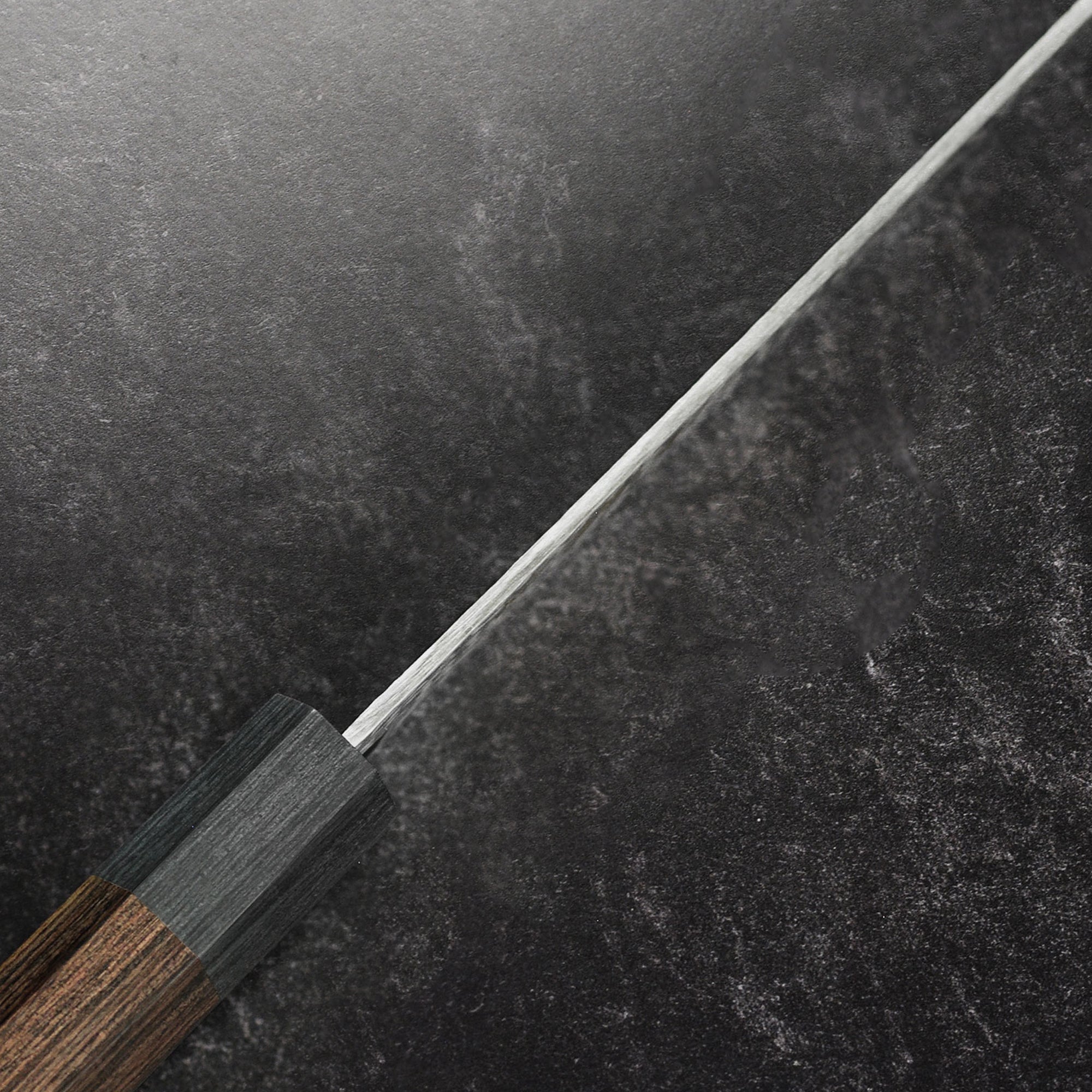 The ergonomic handle of the Ittetsu VG10 petty knife, designed for comfort and precision.