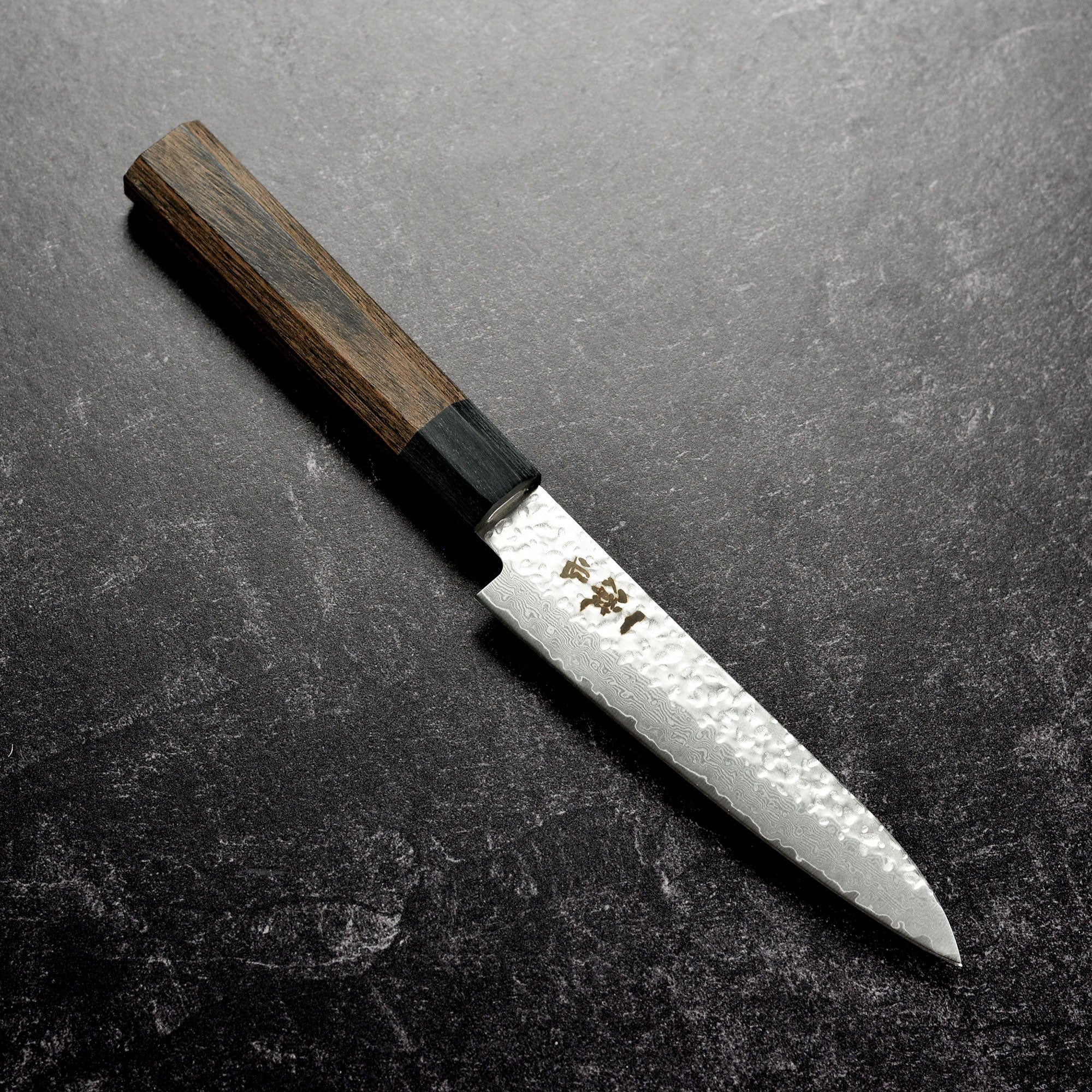 Close-up of the Ittetsu VG10 Hammered Damascus petty knife highlighting its beautiful blade.