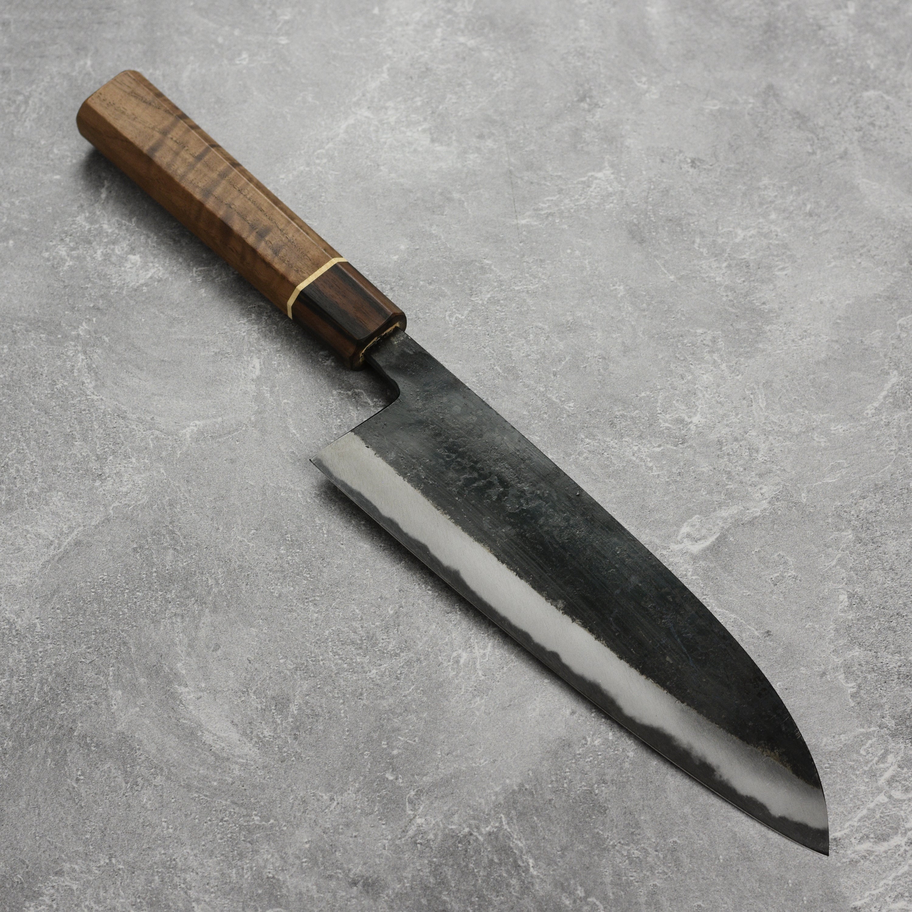 Close-up of the Nishida Shirogami Gyuto Knife highlighting the craftsmanship and steel quality.