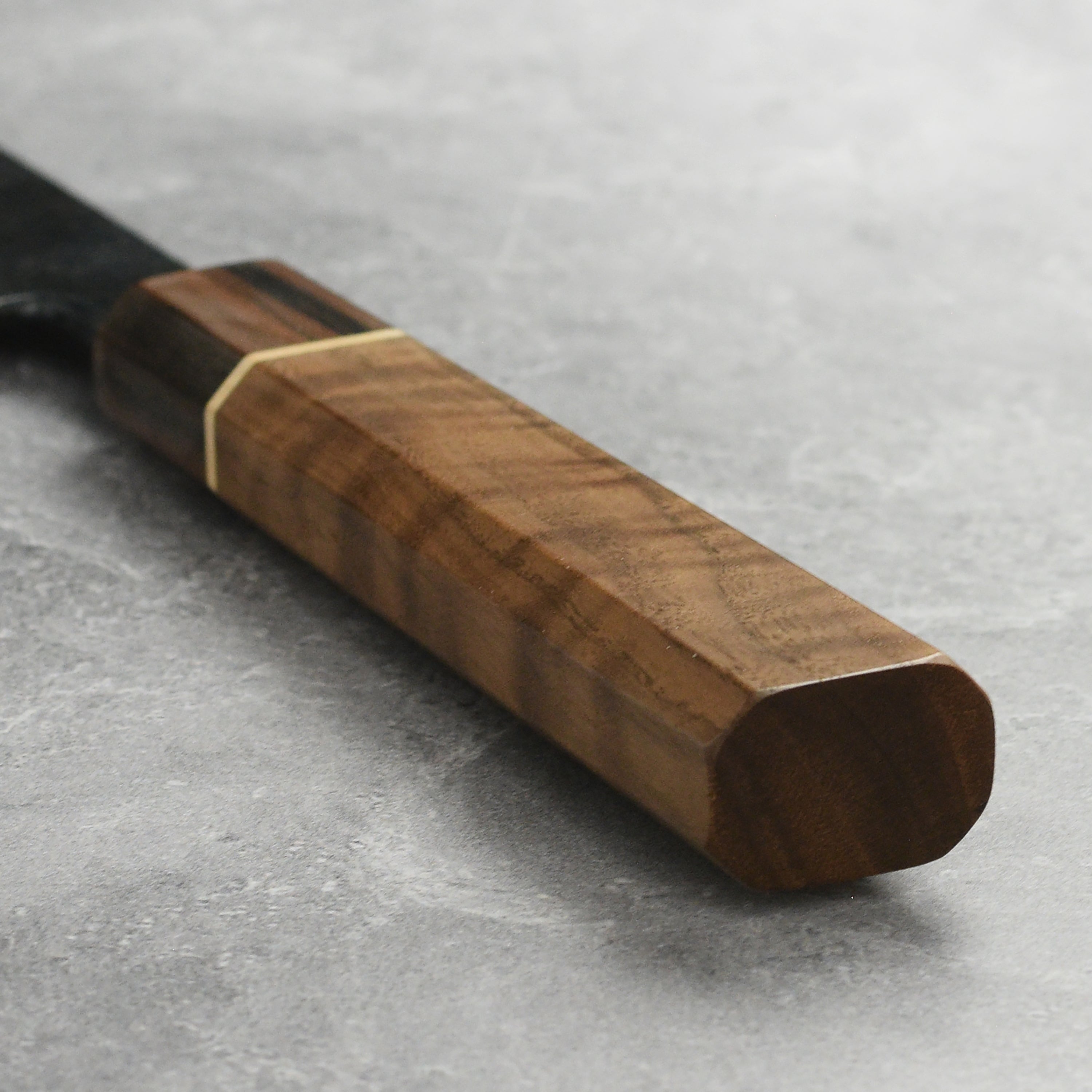 Close-up of the Nishida Shirogami Gyuto Knife highlighting the craftsmanship and steel quality.