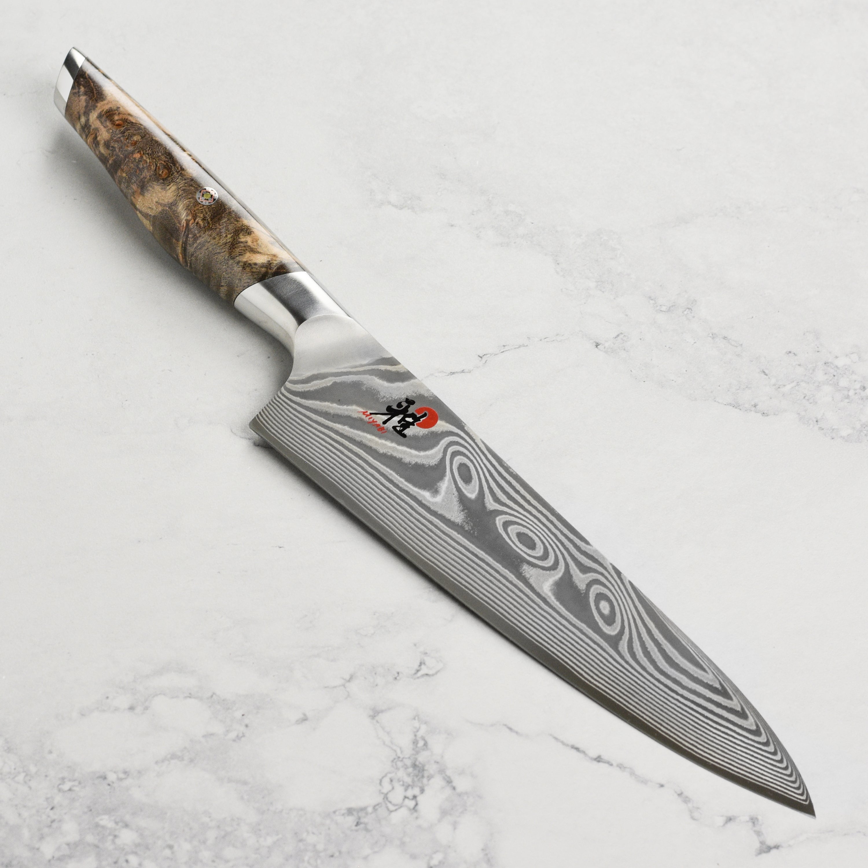 Close-up of Miyabi Iki Damascus pattern on high-carbon chef's knife